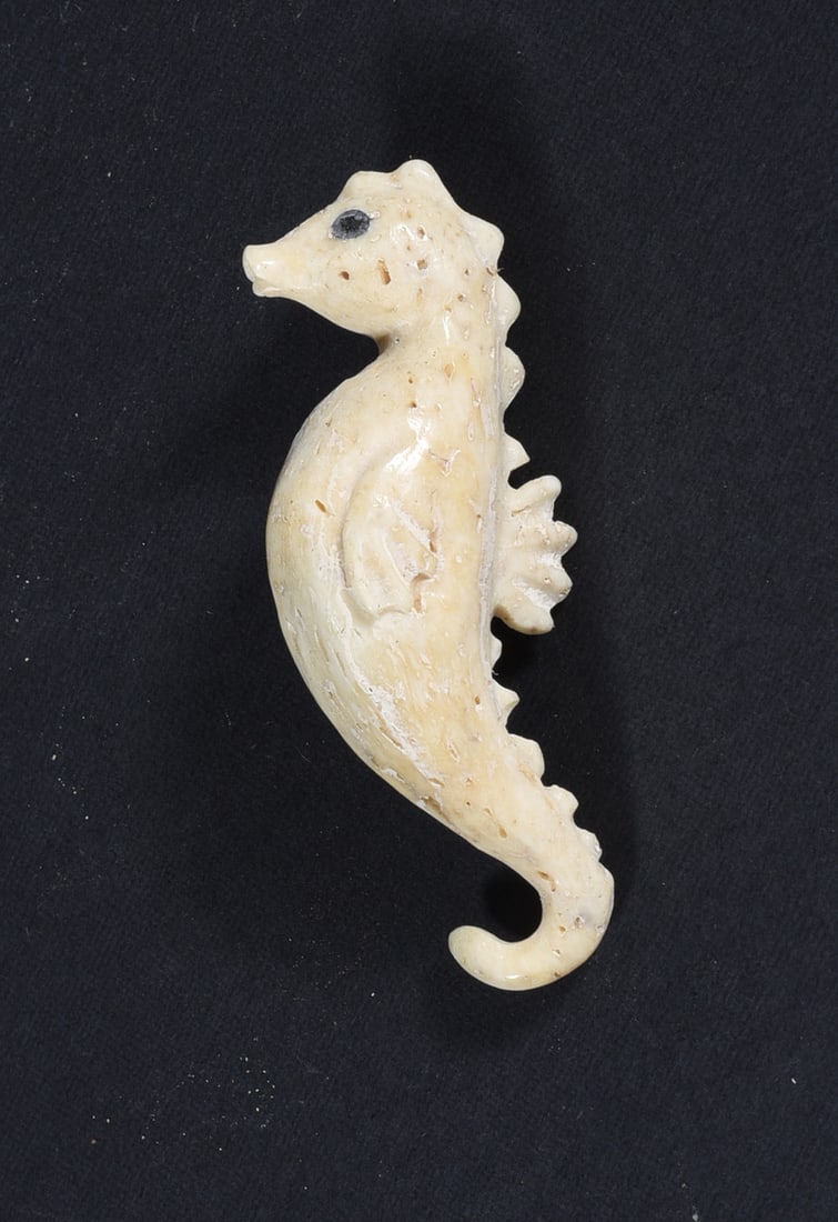 Inuit Carved Whale Bone Figure: These bone carvings were found in an attic trunk wrapped in 1960s newspaper. The collection came straight from the attic to our gallery and we unwrapped and photoed. All of these are small under 7". W