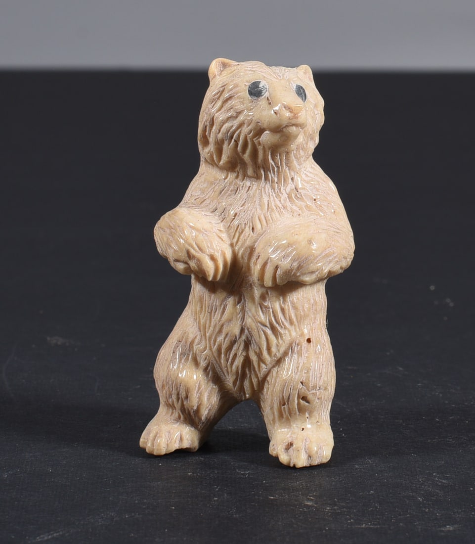 Inuit Carved Whale Bone Figure: These bone carvings were found in an attic trunk wrapped in 1960s newspaper. The collection came straight from the attic to our gallery and we unwrapped and photoed. All of these are small under 7". W