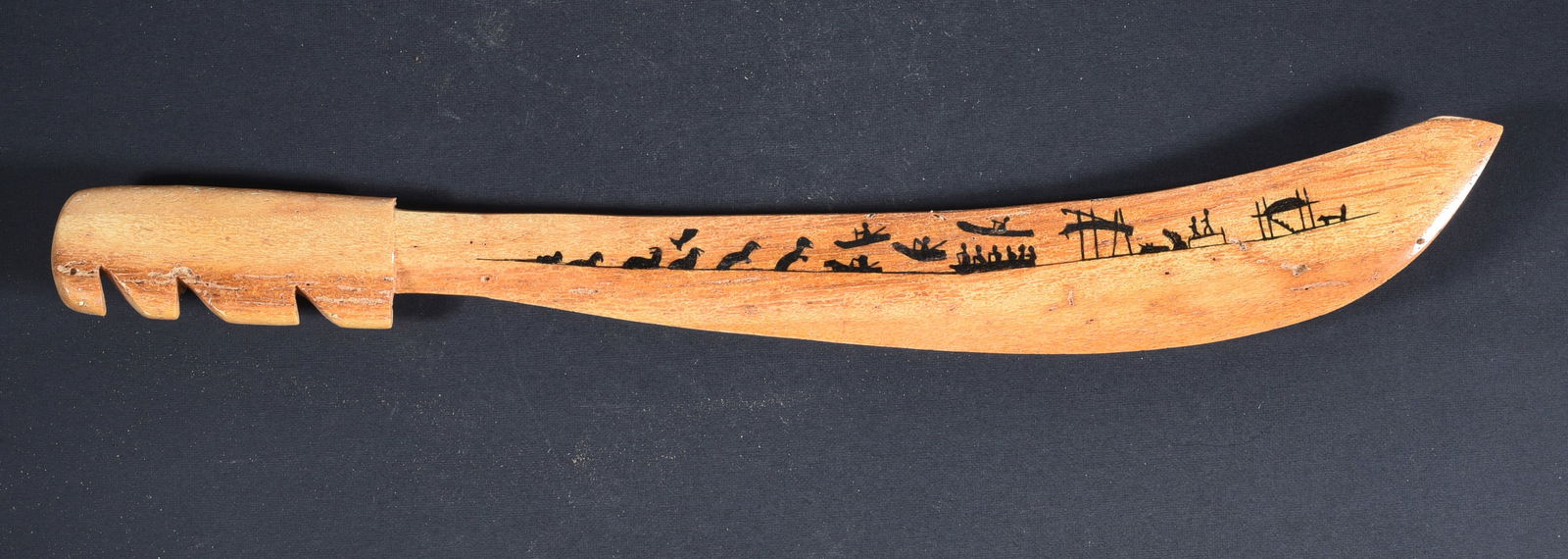 Alaskan Story Knife Made of Carved Bone: These bone carvings were found in an attic trunk wrapped in 1960s newspaper. The collection came straight from the attic to our gallery and we unwrapped and photoed. All of these are small under 7". W