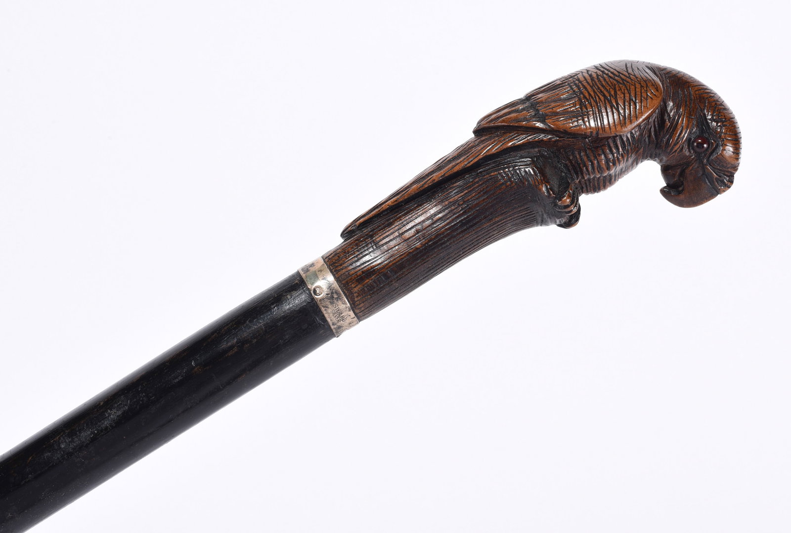 Folk Art Carved Cane Parrot with Sterling Silver: carved parrot with sterling silver band. Ca. 1940. most likely carved in Florida. Glass eyes.