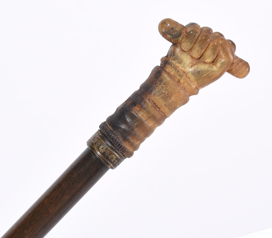 Folk Art Carved Cane Carved Fist: 19th Century carved fist decorated gold band on a plain shaft. Outstanding carving.