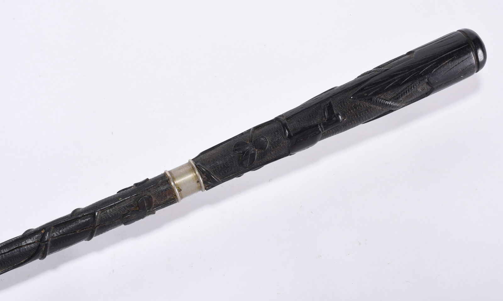 Folk Art Carved Cane Dog and Flowers: Folk carved cane with dog and flowers with a silver band and ferrell. Possibly from Ebony Wood.