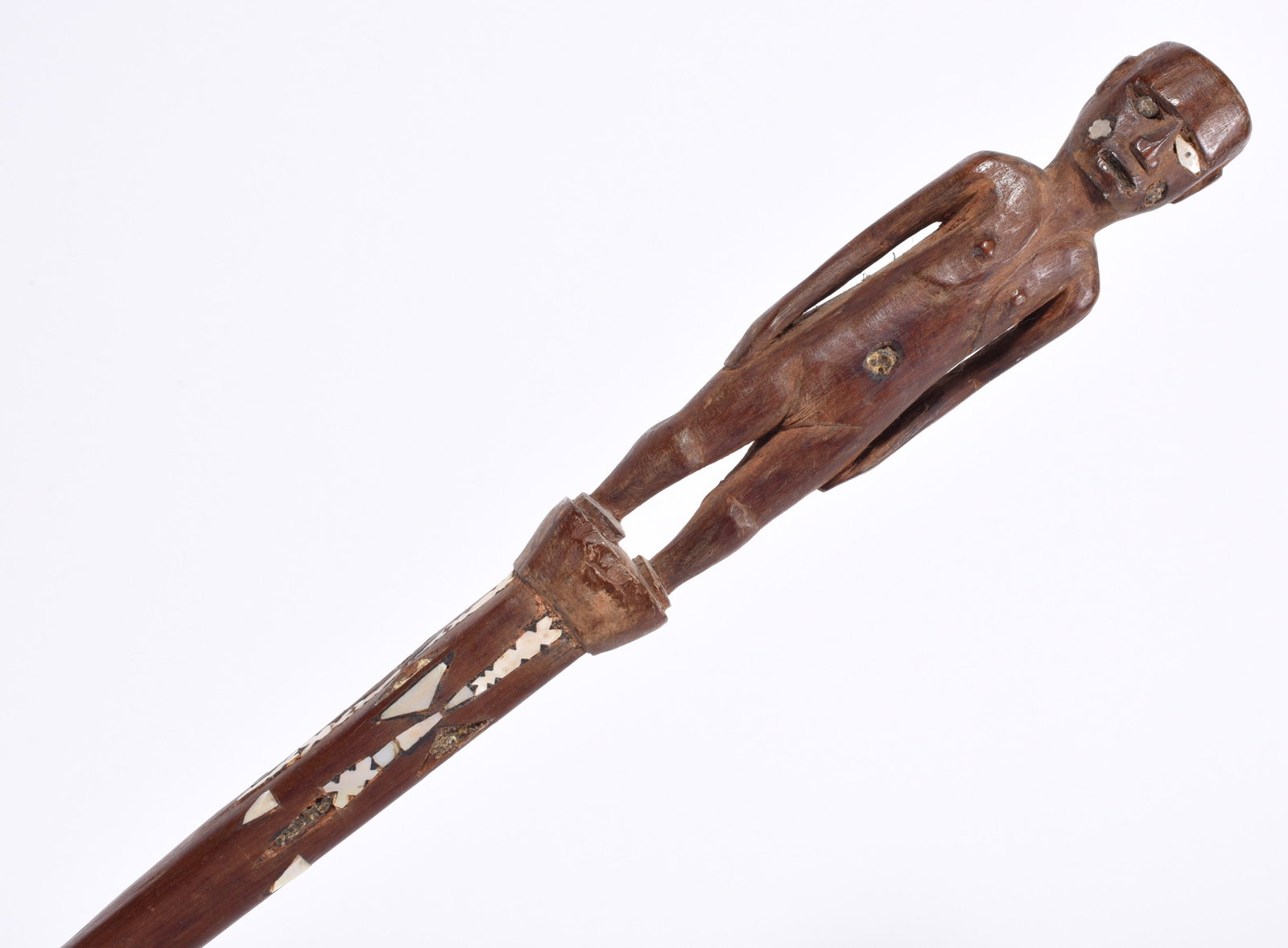 African Folk Art Carved Cane: carving of a full body man with chells eyes and inlay.