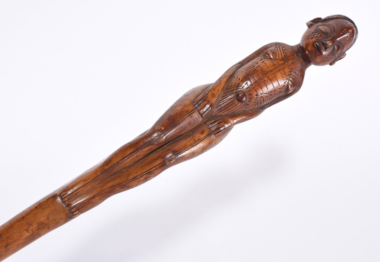 African Folk Art Carved Cane: Carved figure of a man sitting. Ca. 1940