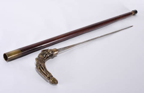 Decorated Skeleton Sword Cane Walking Stick: a very rare sword cane with decorated skulls at the handle marked france.