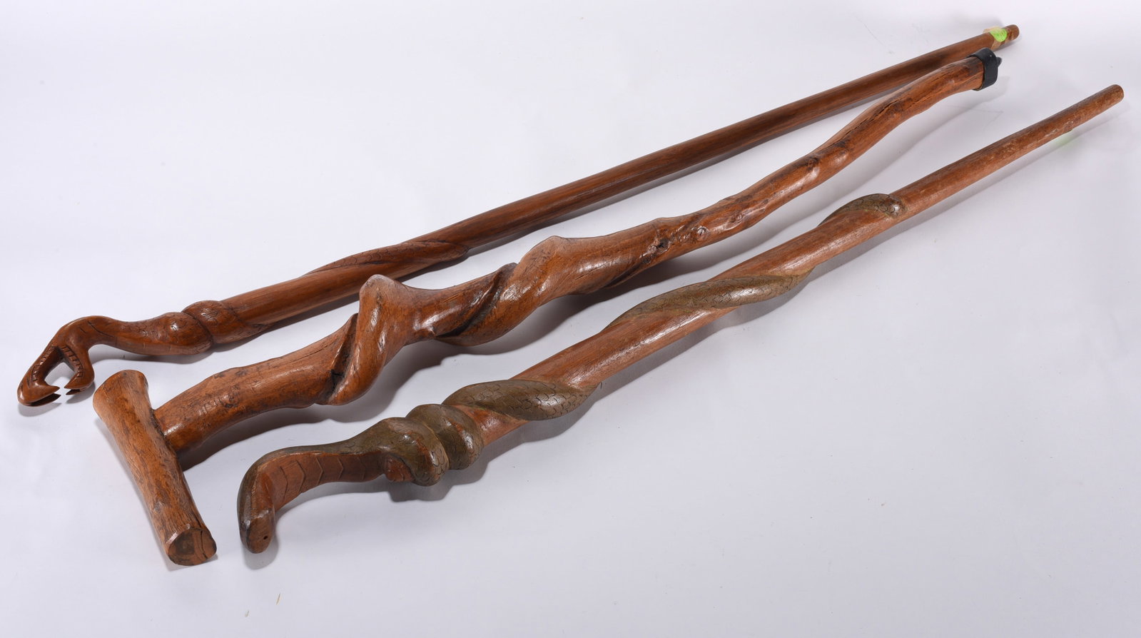 Collection of 3 Carved Canes: collection of 3 carved canes, two with snakes