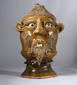 Rieggie Meaders Face Jug on Stand