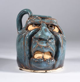 Miniature Face Jug Signed