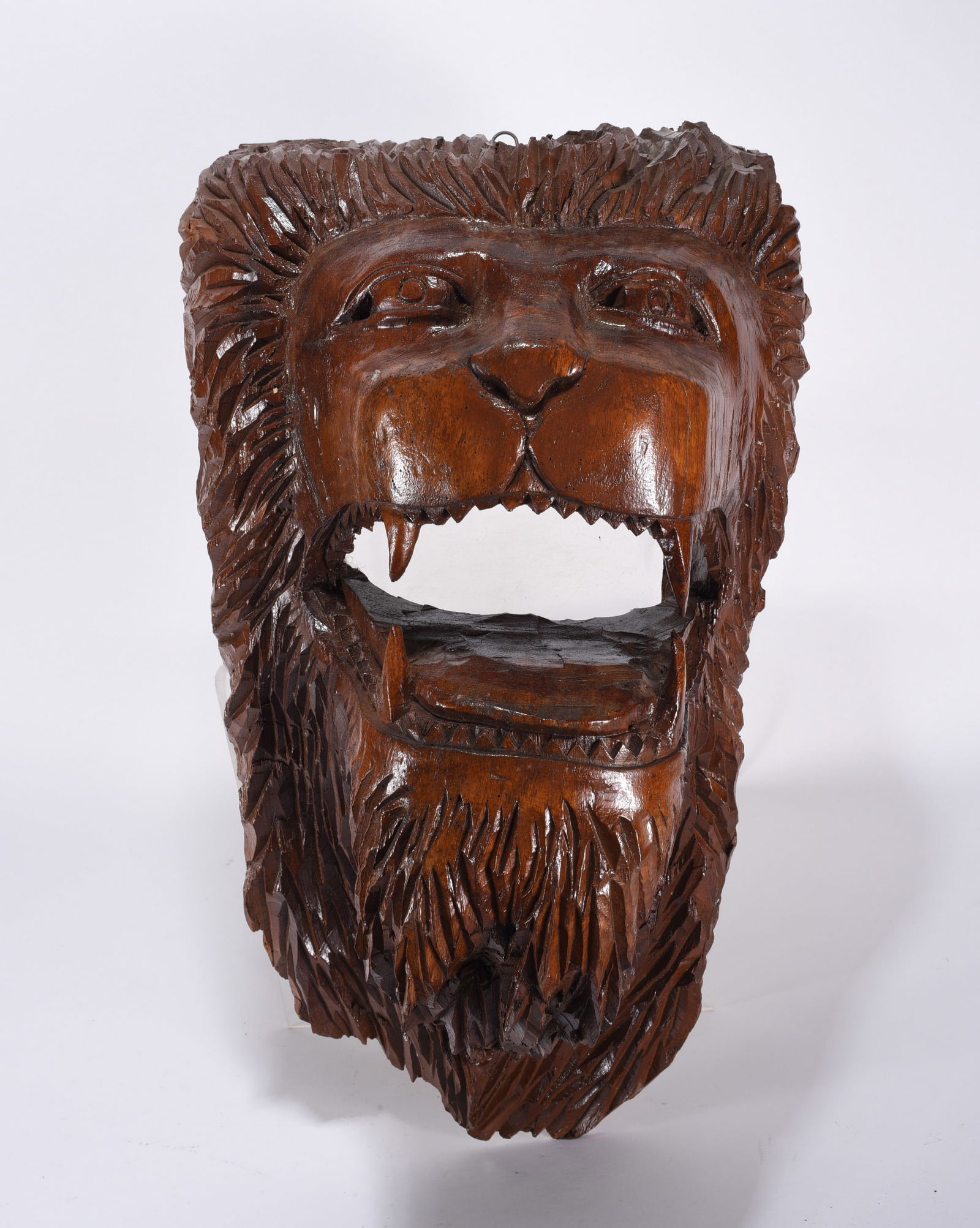 Outstanding Carving of a Lions Head: striking and strong wood carving of lions head. Most likely walnut with glossy finish. Very detailed. Ca. 1940