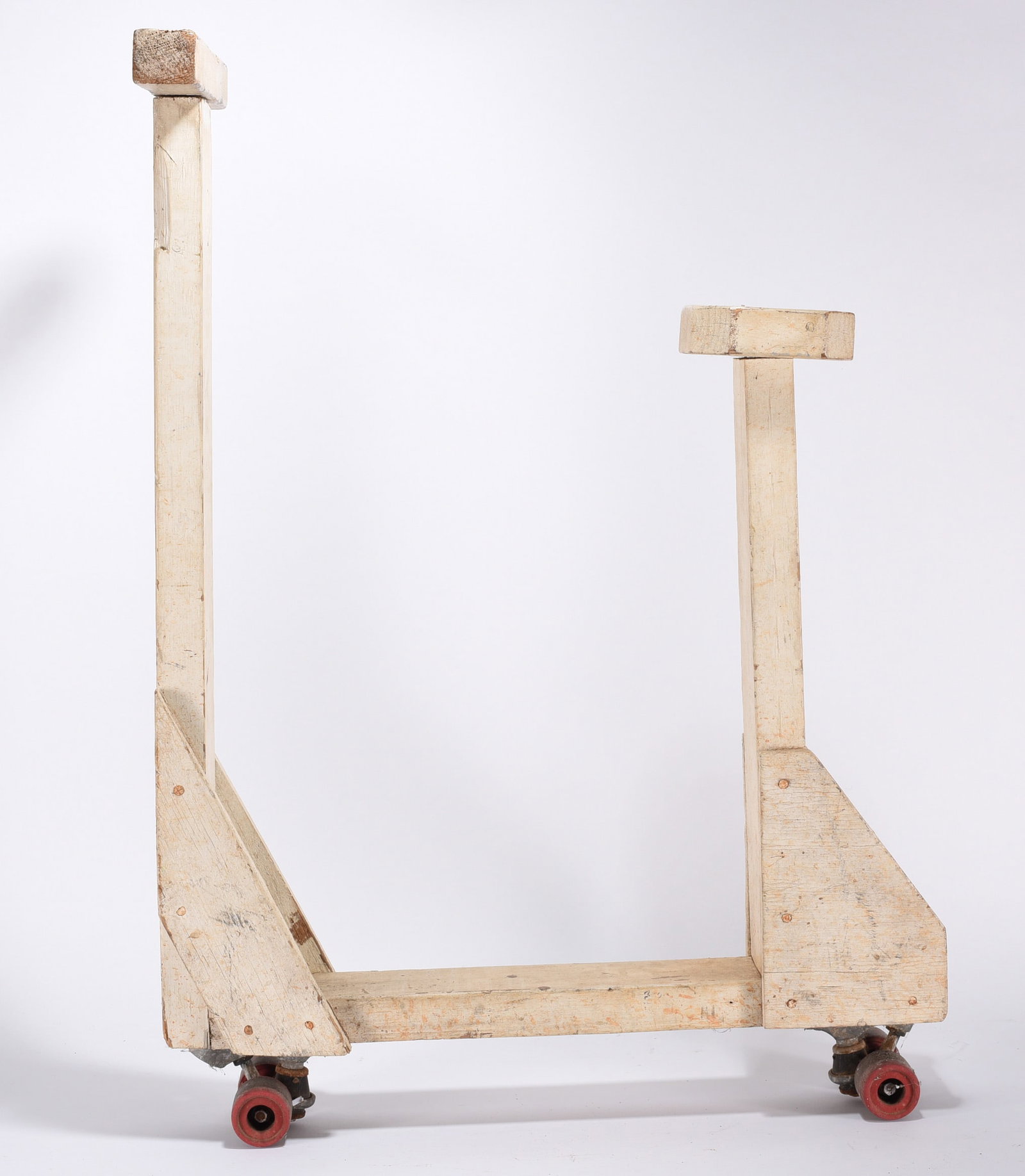 Folk Art Painted Wooden Scooter: Folky home made wooden scooter. Constructed from 2x4s with triangular supports made from 3/4 plywood. The wheels are from an early skate board mechanism or roller skates. Ca. 1950. sturdy and rolls we
