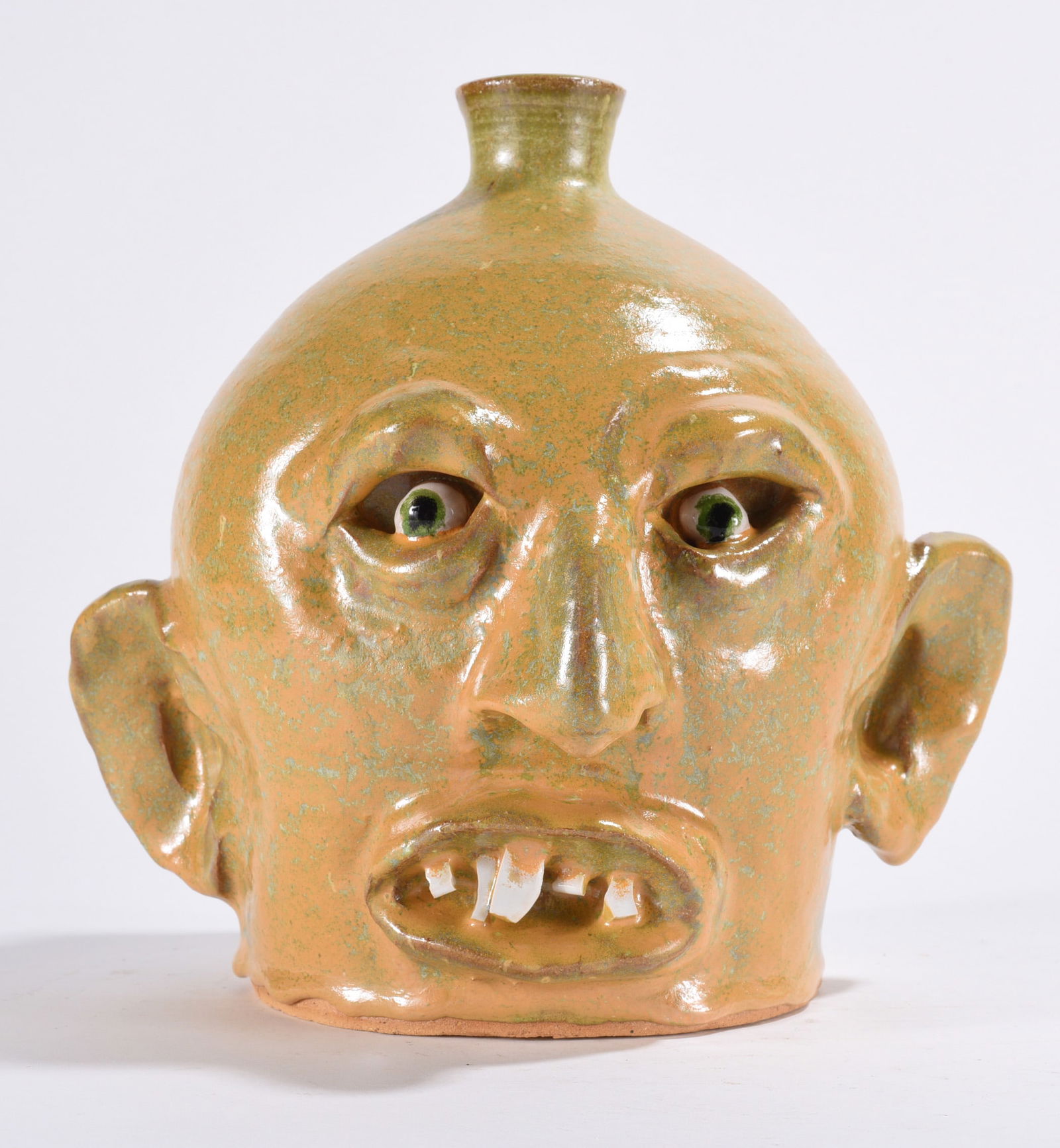Marvin Bailey Face Jug: very nice face jug in a lite glaze with china plate teeth and clay eyes. Signed on bottom.