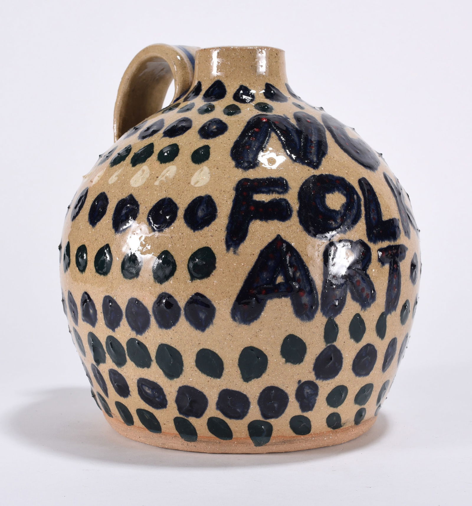 Dale Costner Folk Art Pottery Jug: slip decorated jug very very folky! 7" All items can be in house shipped to get in house shipping select SELF ARRANGE. Shipping takes 3 weeks or less but up to 3 weeks.