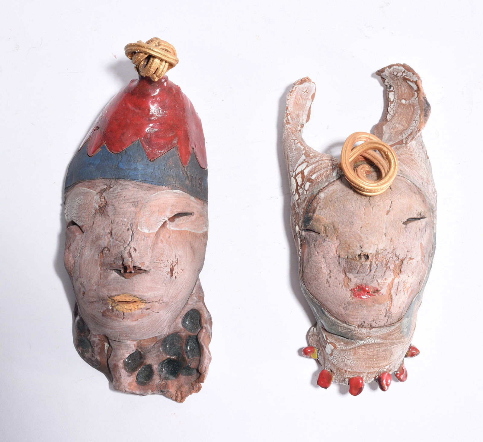 Folk Pottery Clay Masks: two clay masks, 7.5"