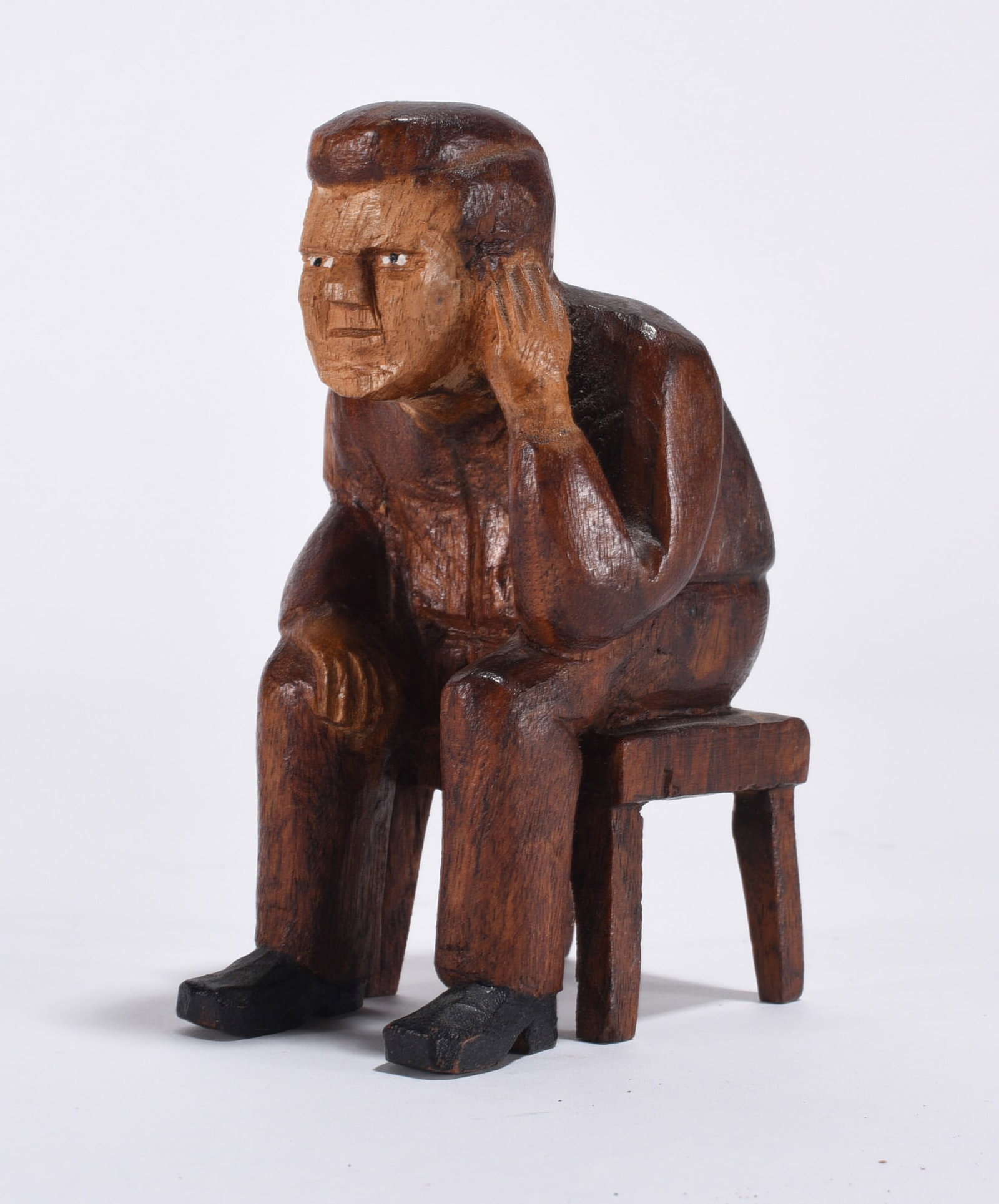 Folk Art Carved Thinking Man: carved man sitting on stool. 4.5"
