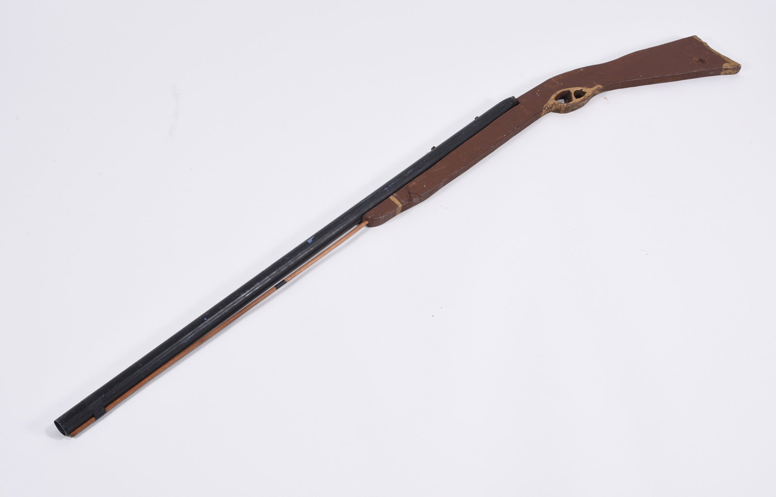 Folk Art Wooden Rifle: 54" wooden rifle, paint. Ca. 1950