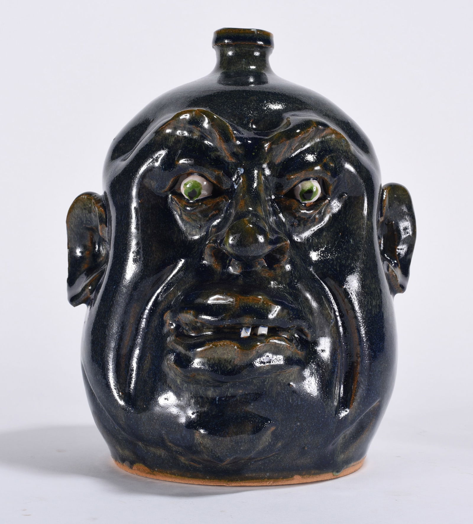 Marvin Bailey Face Jug: 9.5" - grotesque face jug by Marvin Bailey. Two china plate teeth clay eyes. Fantastic artwork on the facial features. A true piece of art.