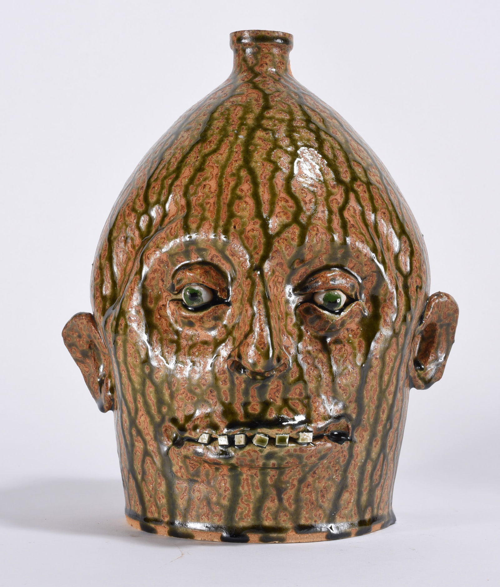 Marvin Bailey Face Jug: 10.5" - lite alkaline glaze like drips. Small china plate teeth with clay eyes. The drips are amazing. Uncontrolled from the firing but came out so well. Signed on bottom.