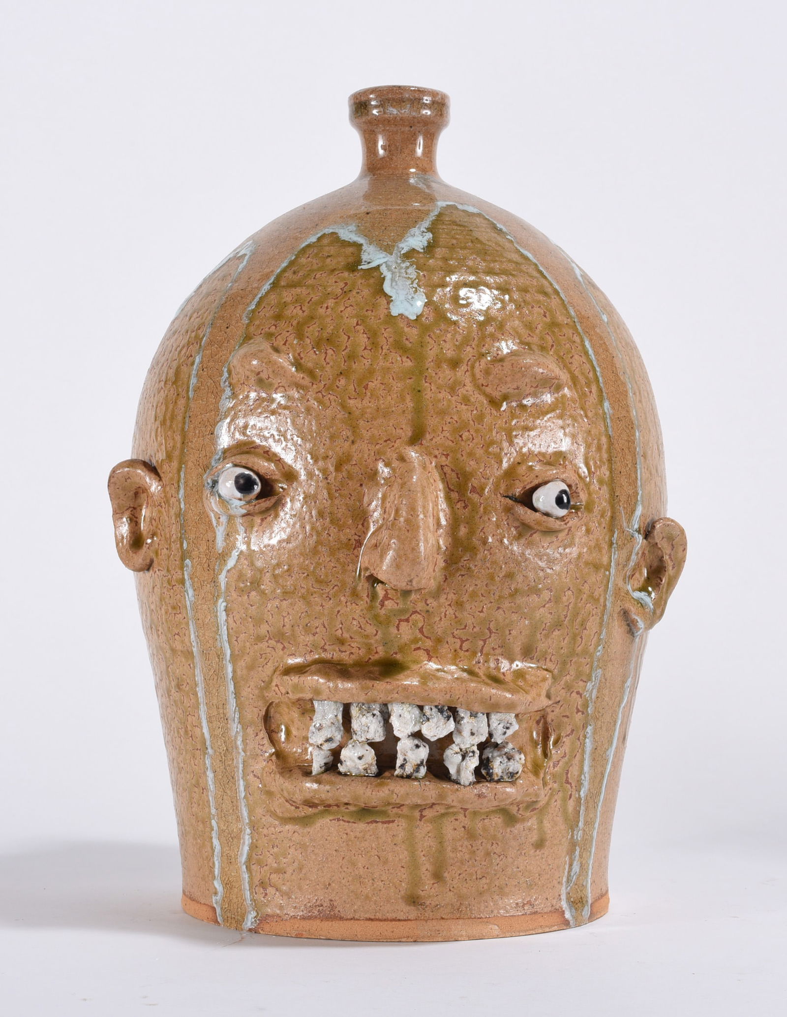 Marvin Bailey Rock Tooth Face Jug: 11" - rock teeth, clay eyes… they don’t look like rocks… they are rocks. Double row of rock teeth to be percise. A nice lite glaze. Signed on bottom.