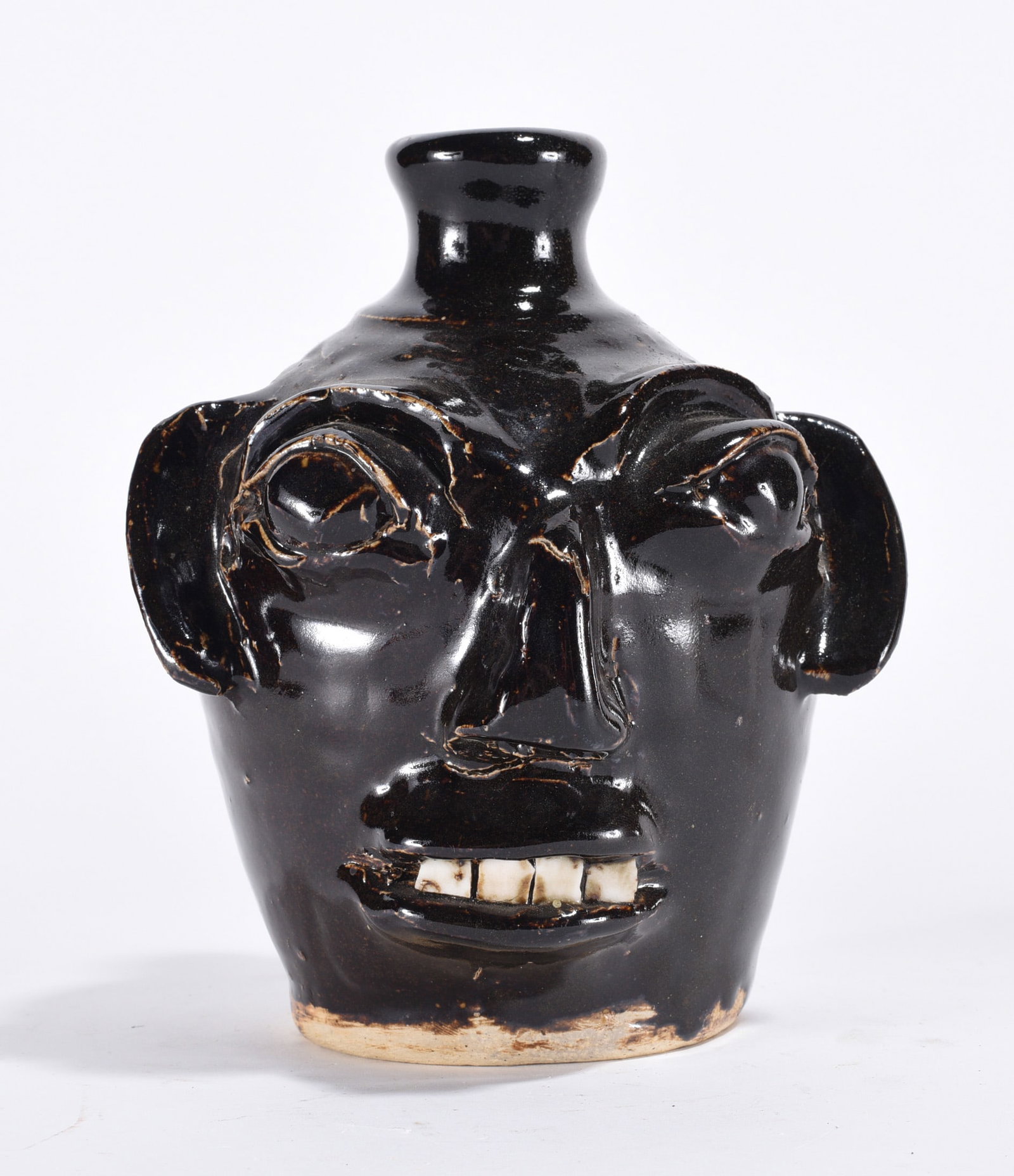 Burlon Craig Face Jug: 6" face jug by Burlon Craig. The handle has been glued back. As we see it we will call it. And also this is seen in the picture. Signed on bottom.