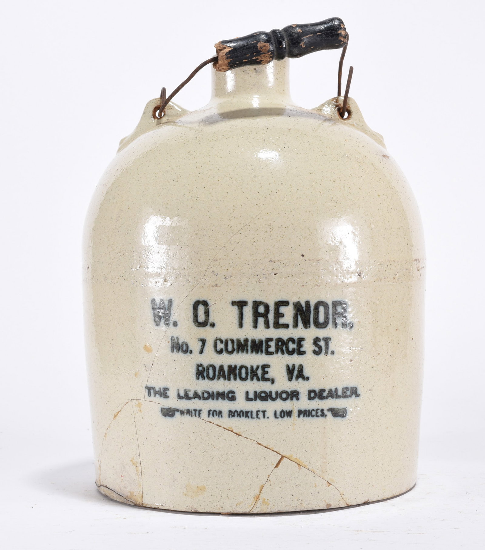 W.O. Trenor Advertising Jug, Roanoke, Virginia: Black letter jug. "W.O. TRENOR, No. 7 COMMERCE ST. ROANOKE, VA. THE LEADING LIQUOR DEALER" . With wire handle.