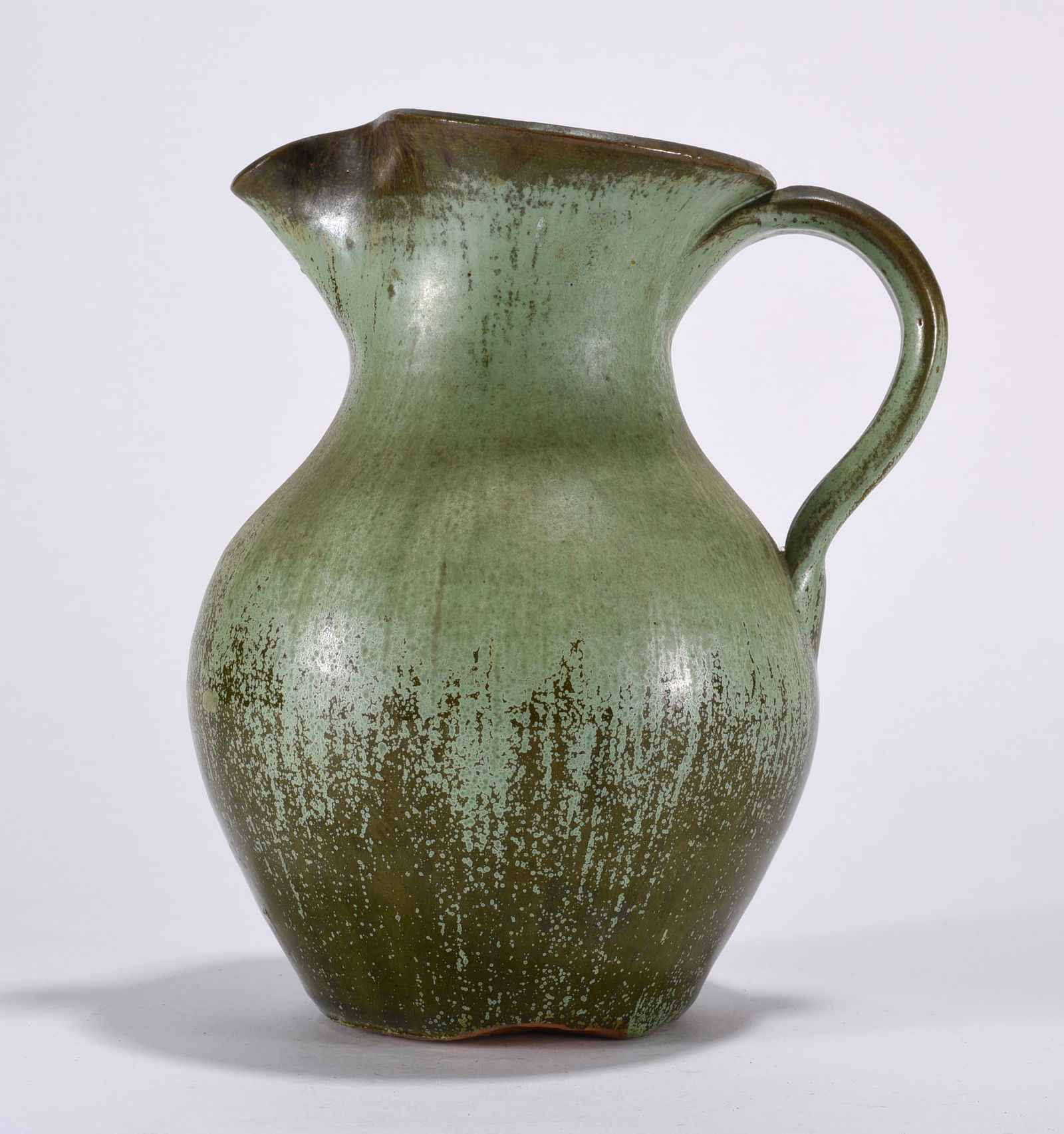 Green Pottery Pitcher: Green pitcher.