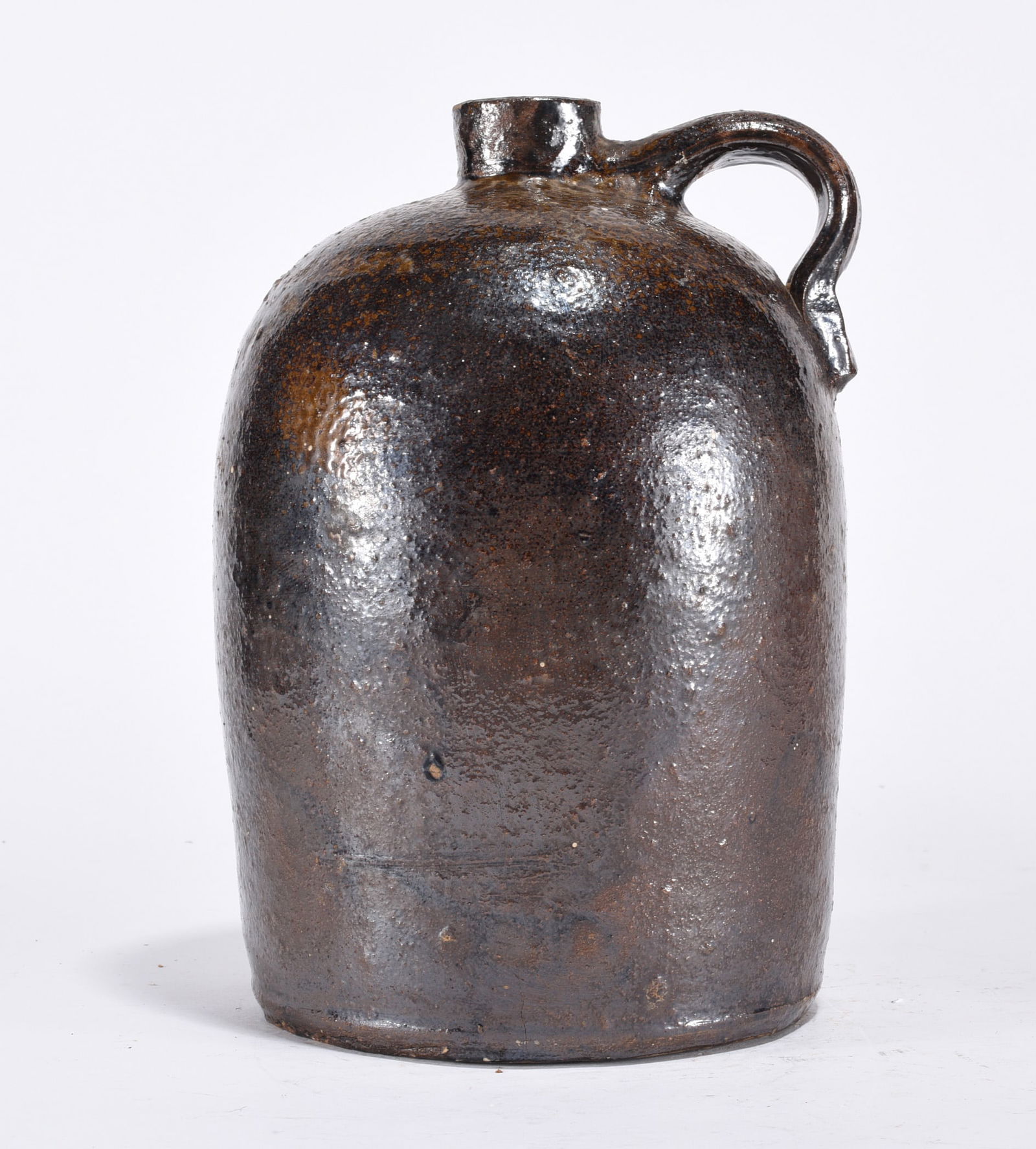Pottery Jug: Pottery jug. Brown/black.