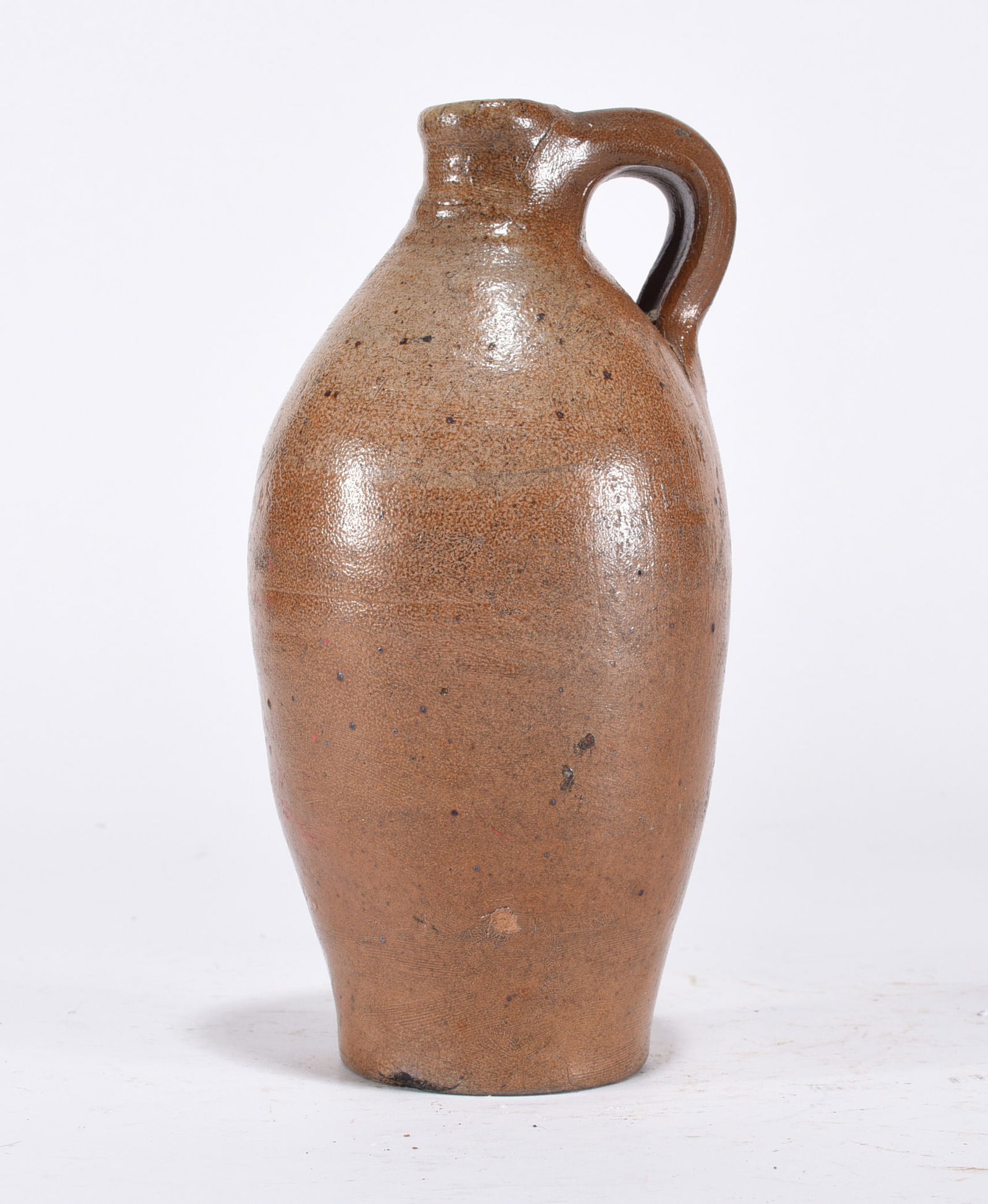 Orange Pottery Jug: Pottery jug. Orange.