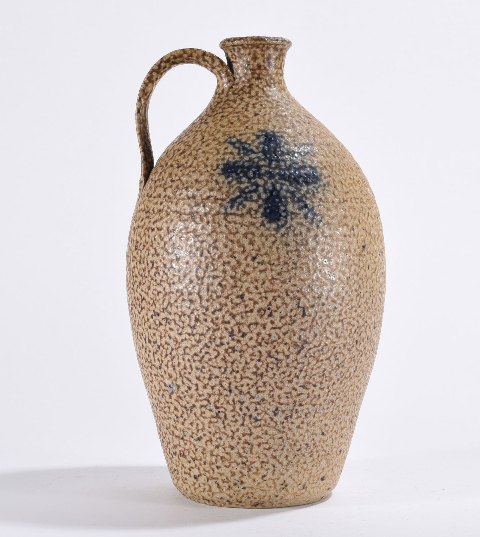 Pottery Jug with Blue Design: Pottery jug with blue design.