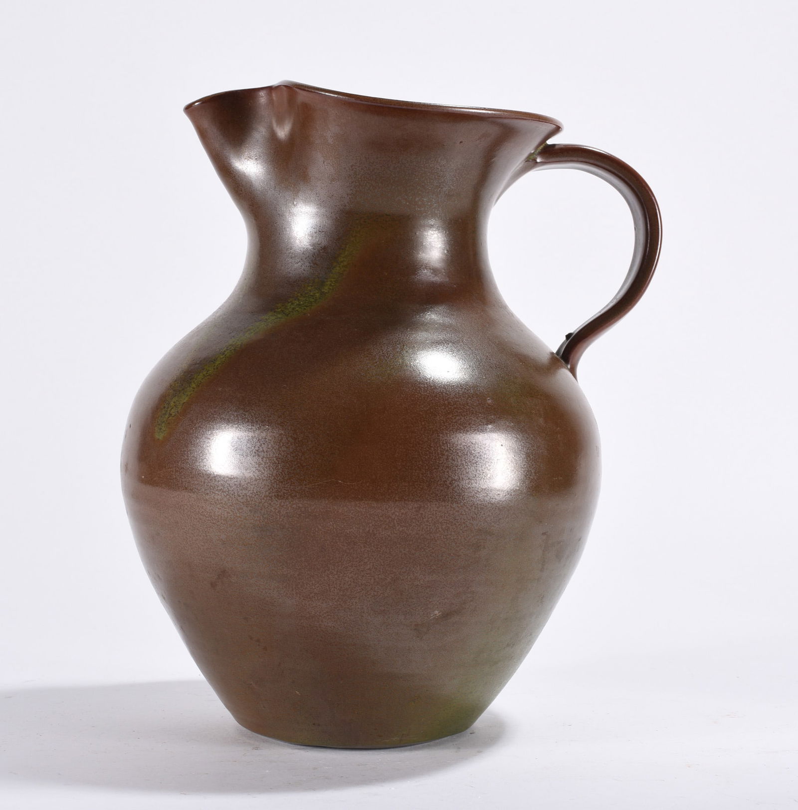 Pottery Pitcher: Pottery pitcher. Green in glaze.