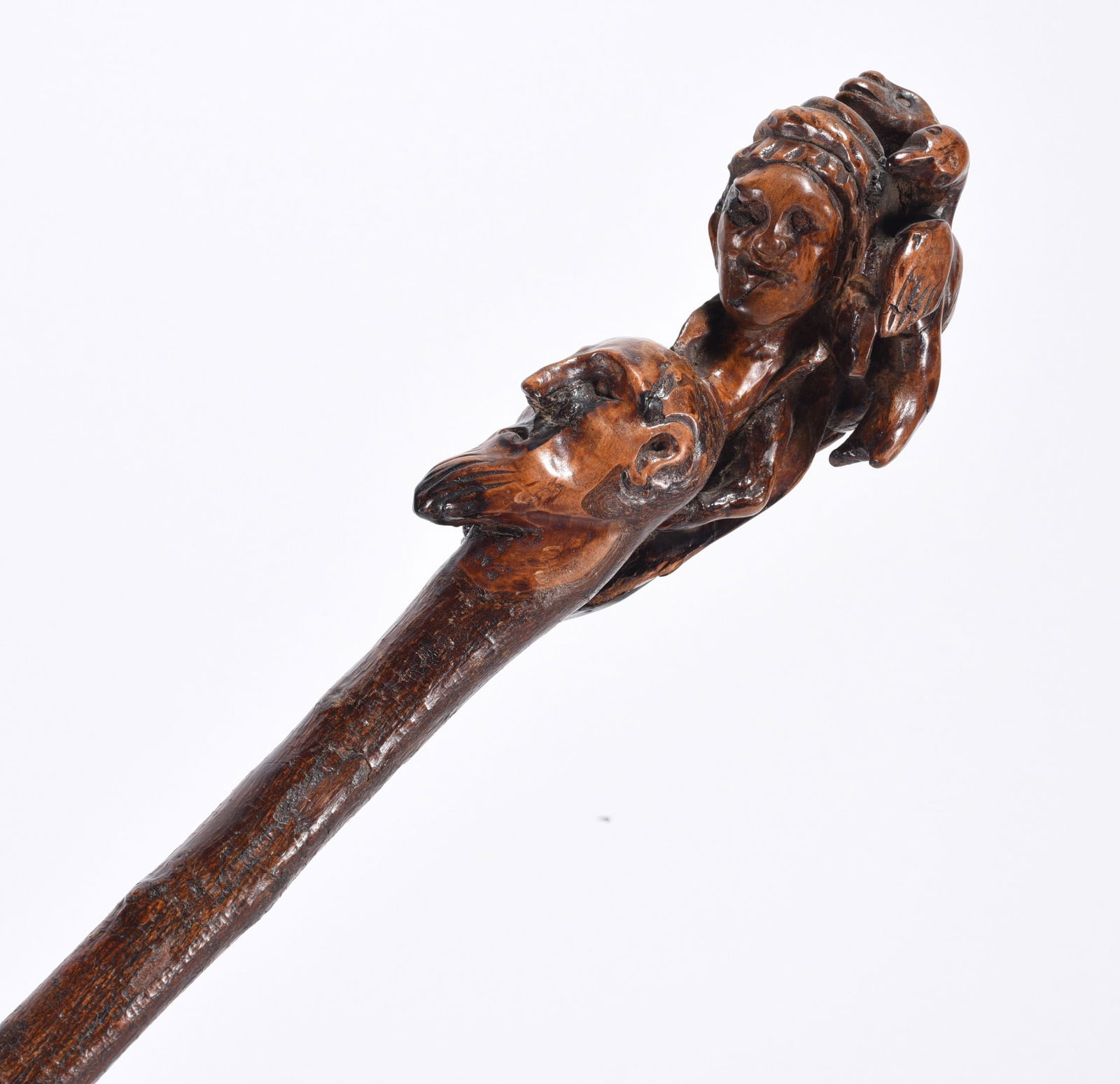 The Witches Cane Folk Art Walking Stick ca. 1890: the witch on his back with a crow and monkey on her back. Ca. 1890