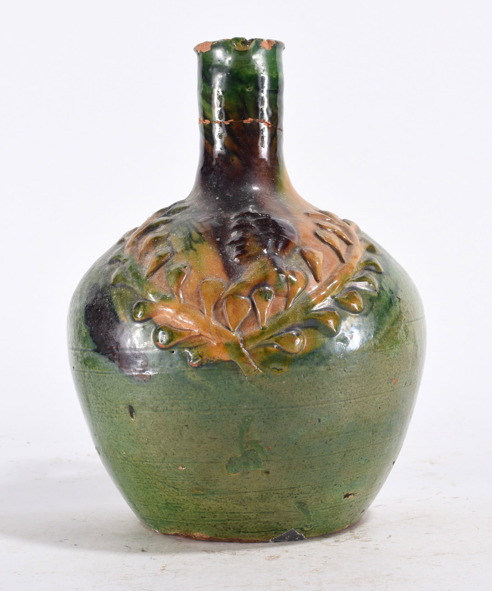 Green Slip Decorated Pottery Bottle: Green Slip Decorated Pottery Bottle please see photos for condition. All items are in estate condition We do offer in house shipping for items under 36" boxes 10"x10"x10" we can ship for around $21. b