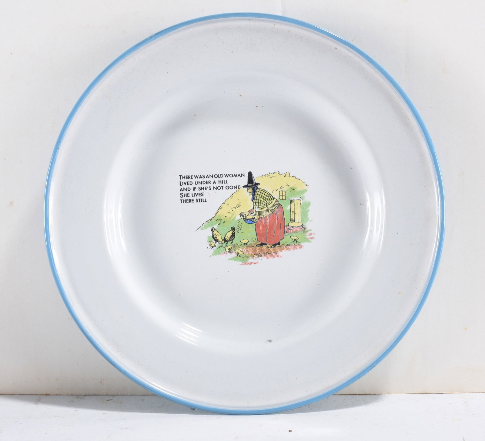 Child’s Nursery Rhyme Plate: Child’s enamelware plate with nursery rhyme illustration of old woman and text. We do offer in house shipping for items under 36" - boxes 10"x10"x10" we can ship for around $21 or less. - boxes 18x1