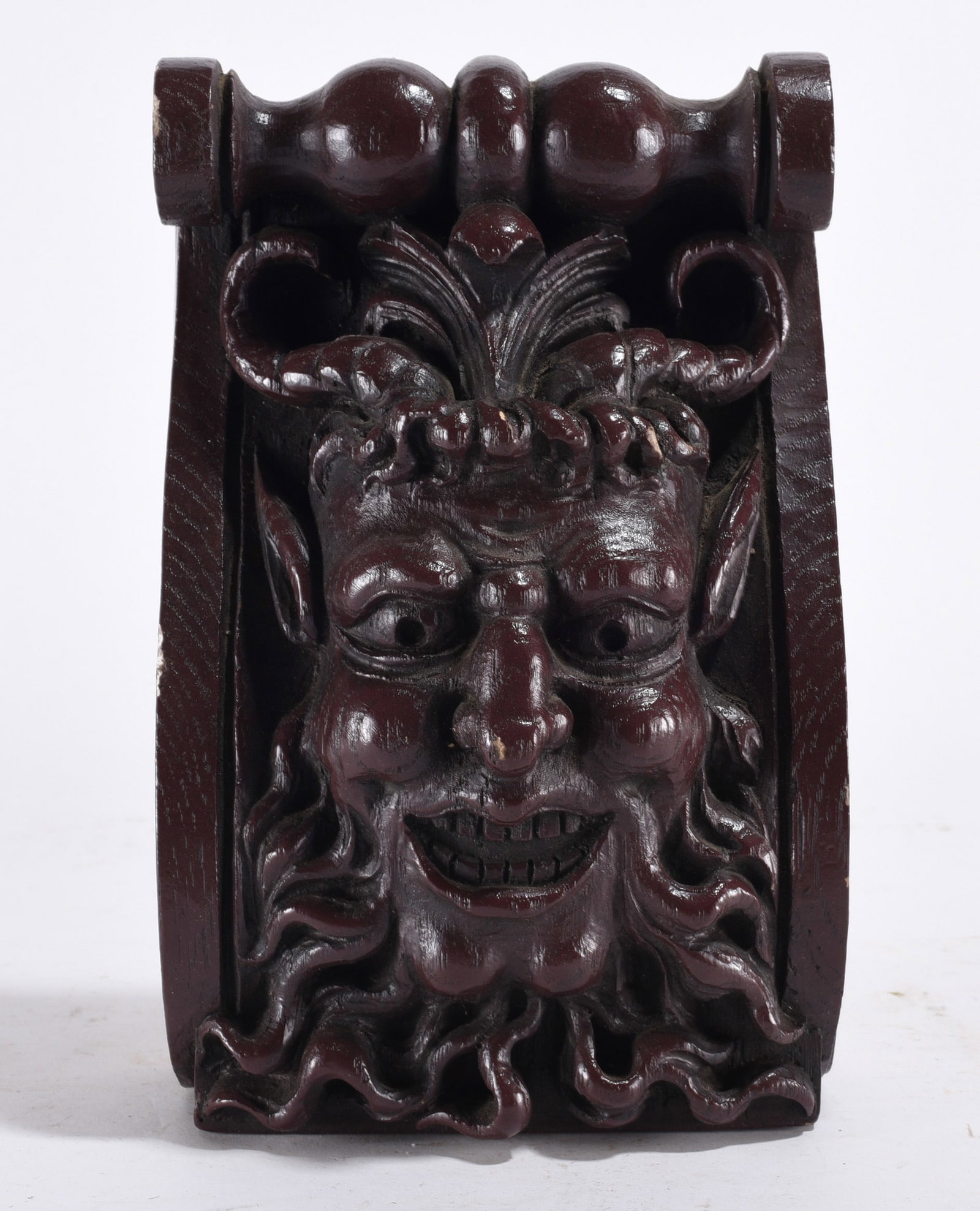 Carved Wood Grotesque Mask: Dark stained carved wood architectural face