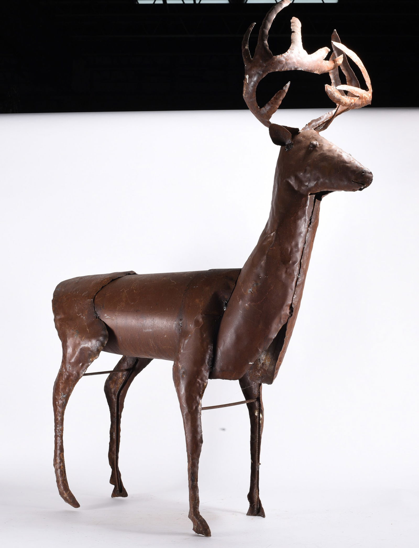 Folk Art Metal Deer Sculpture: Handmade sheet metal deer with large antlers