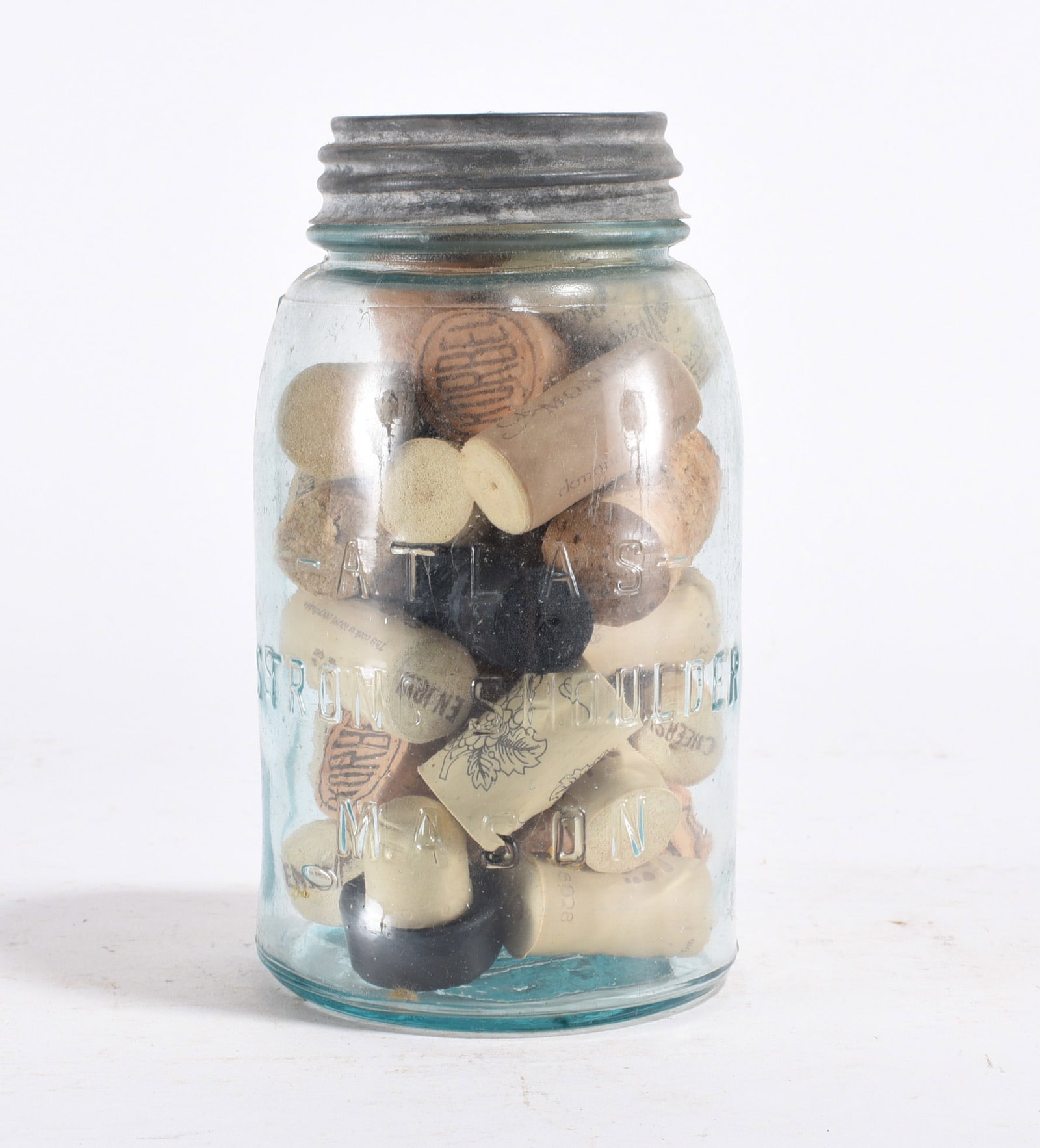 Atlas Mason Jar w/ Corks: Glass jar filled with assorted cork stoppers