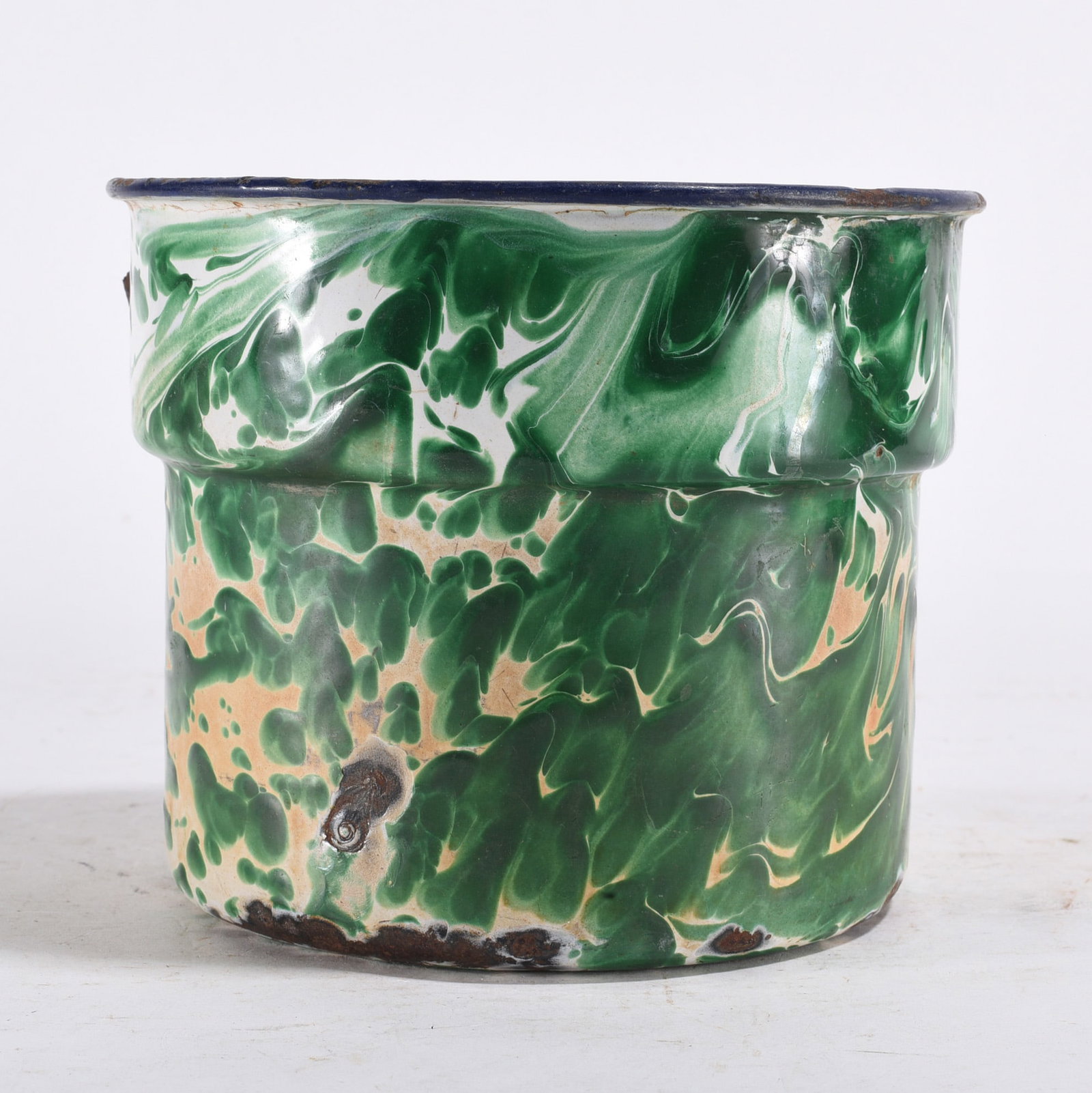 Blue & White Enamel Mug: Enamel mug with blue and white marbled pattern, chipping and wear