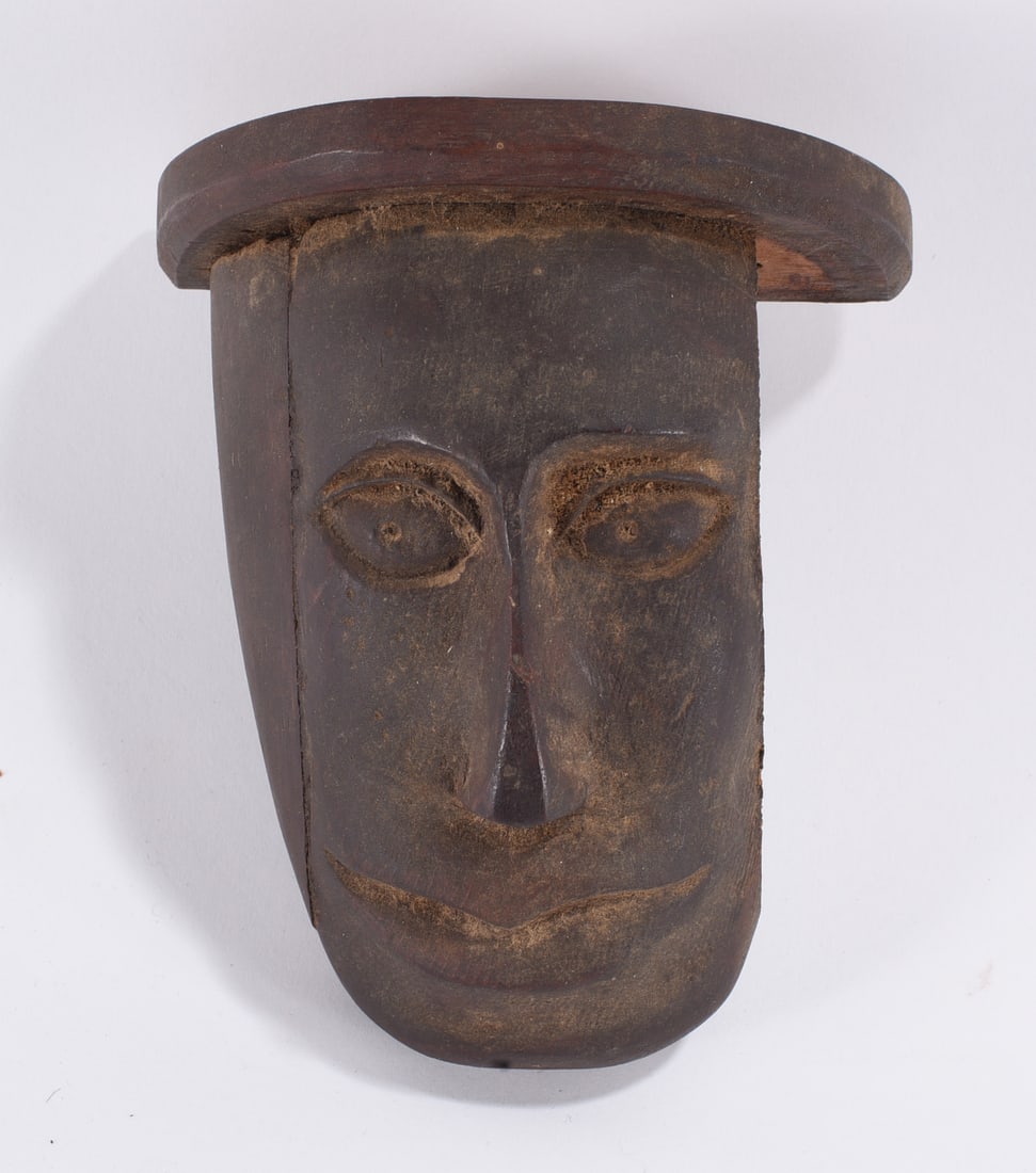 Carved Wooden Tribal Mask: 5" -- Carved wooden tribal style mask with elongated facial features and patina
