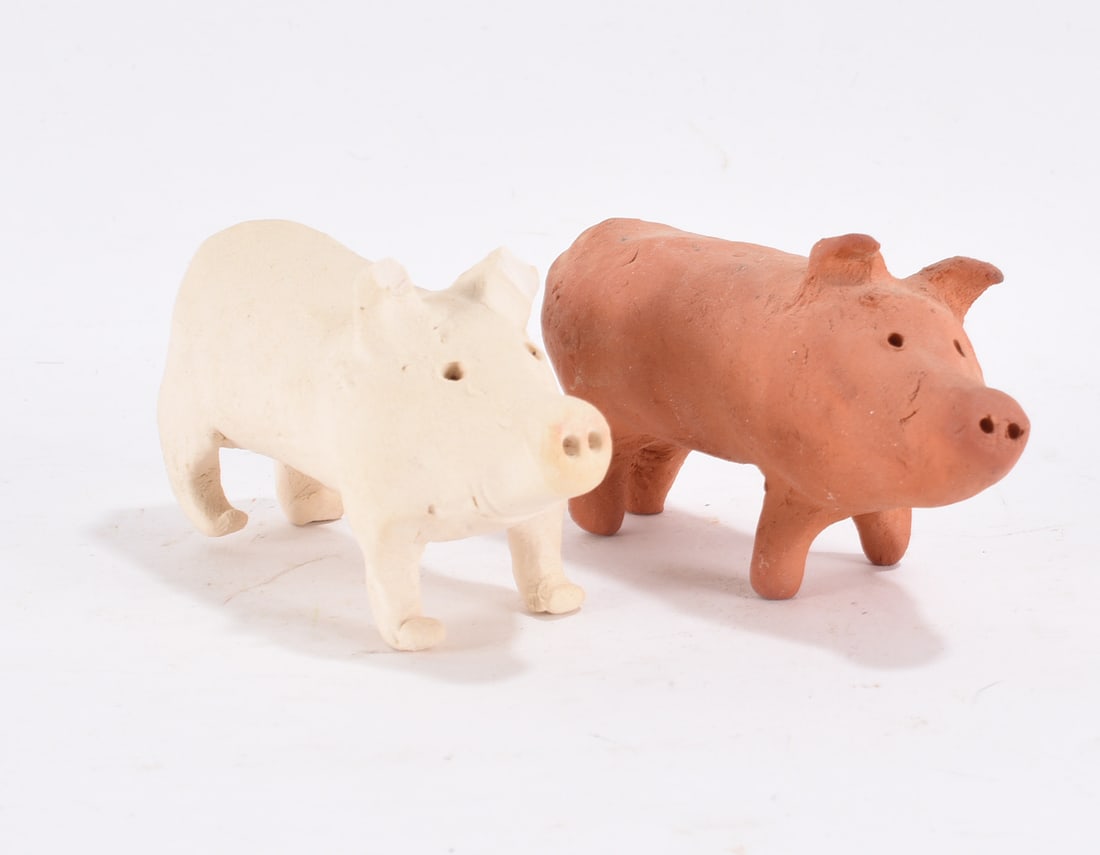 Two Pottery Pigs: 2"x3" -- Unsigned pottery pigs please see photos for condition. All items are in estate condition We do offer in house shipping for items under 36" boxes 10"x10"x10" we can ship for around $21. boxes 