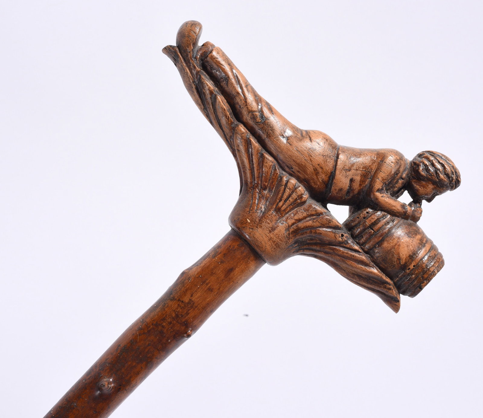 Folk Art Cane Walking Stick: 34" folk art carved cane of man drinking from a barrell. Ca. 1910. a very nice carving. please see photos for condition. All items are in estate condition We do offer in house shipping for items under