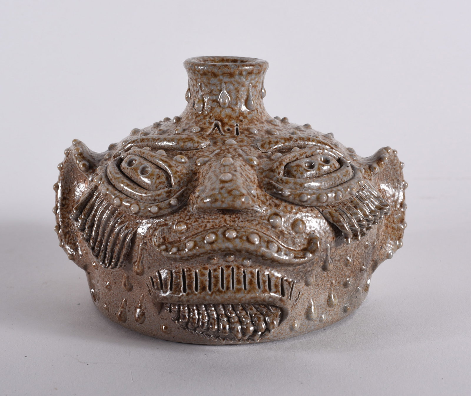 Michael Gates Pottery Face Jug: 3" x 5" pottery face jug by Michael Gates. Michaael Gates is a descendent of the Reinhardt family of potters in North Carolina. please see photos for condition. All items are in estate condition We do