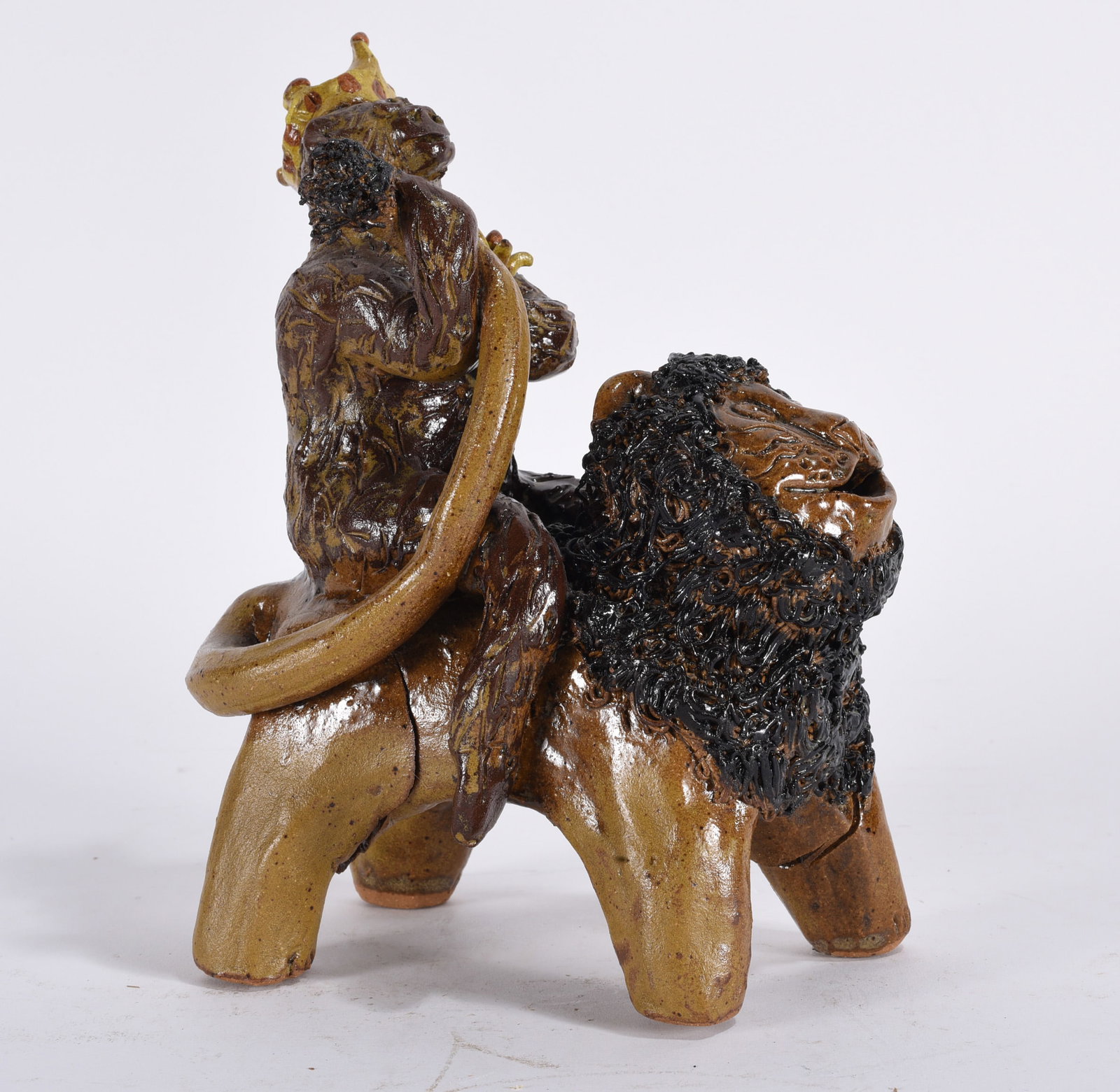 Crystal King Folk Pottery Lion King: 9"x6" folk pottery lion with a king on top. This piece is in as fired condition. Fireing cracks. For you new collectors. This is a flaw but in as fired condition this is a seemingly rare piece and doe