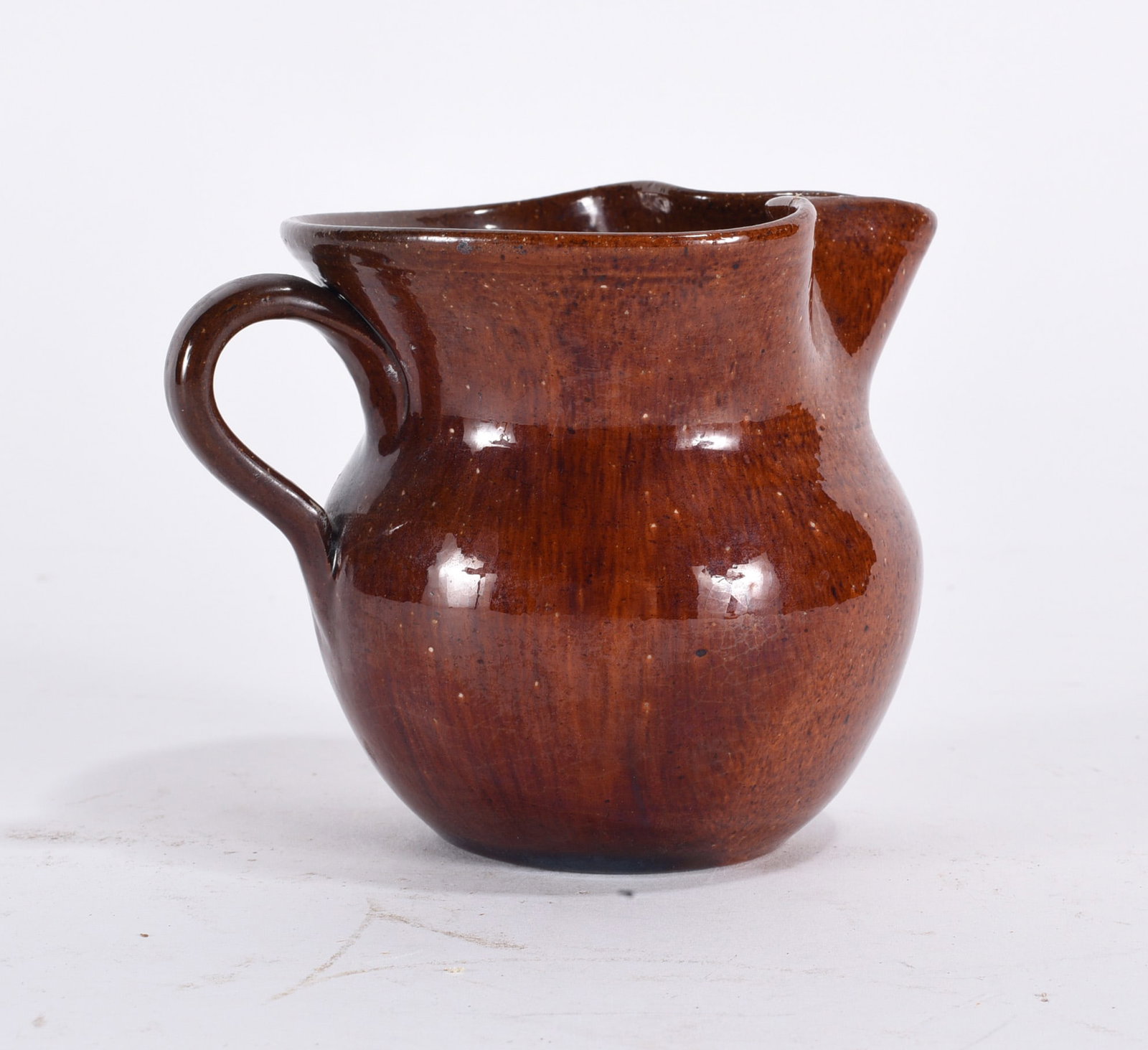 Ben Owen Jugtown Pitcher: 4" jugtown pitcher stamped on bottom. please see photos for condition. All items are in estate condition We do offer in house shipping for items under 36" boxes 10"x10"x10" we can ship for around $21.