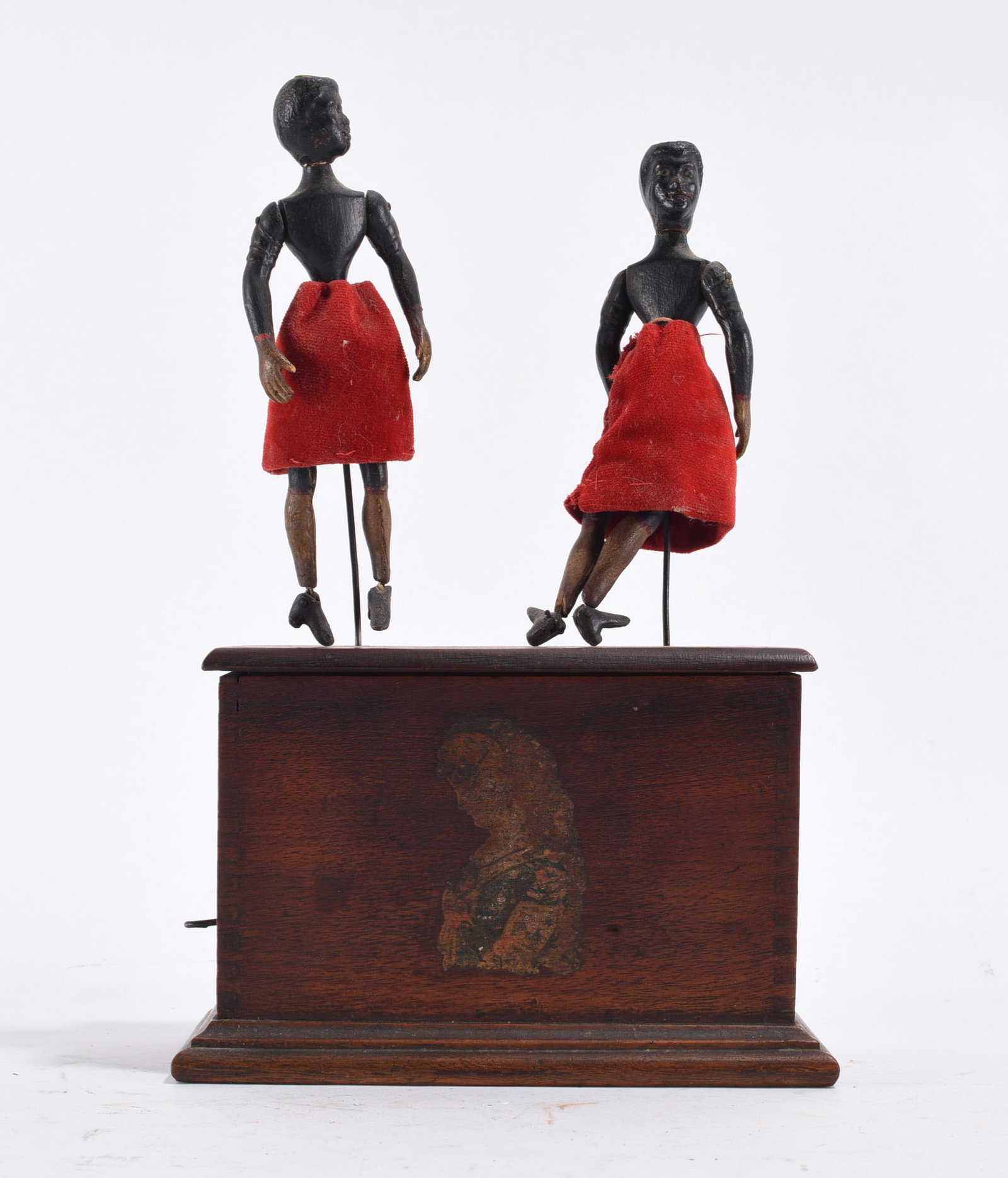 Folk Art Black Mechanical Dancers: 10 "--carved wood and paint ca. 1890. Mechanical wind up box with two dancers. please see photos for condition. All items are in estate condition We do offer in house shipping for items under 36"