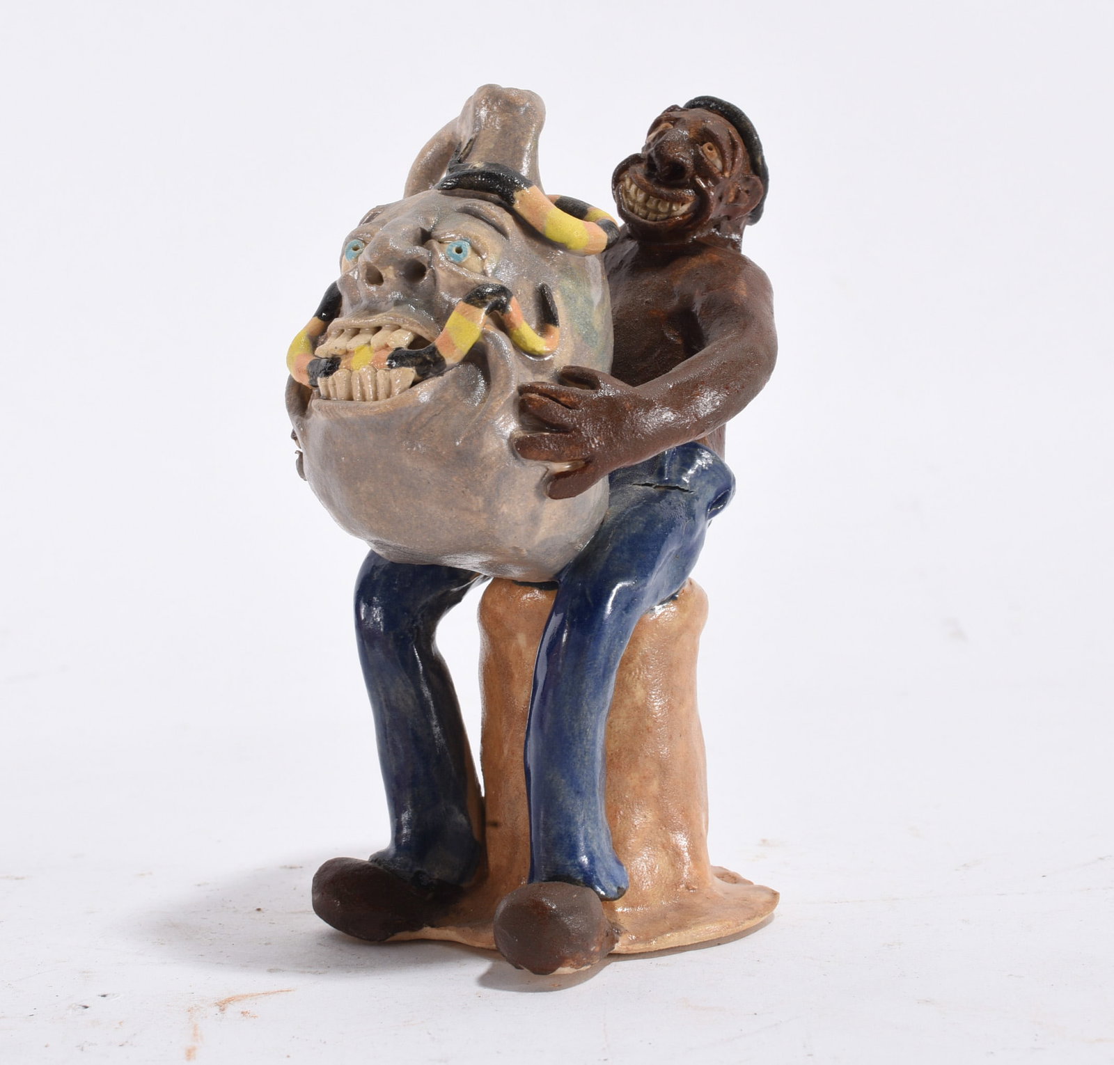 Stacy Lambert Black Man Figural: 4" --outstanding and rare figural of black man holding a large face jug with a snake. A very early example of Stacy Lamberts work dated on the bottom 1996. Condition is excellent. please see photos