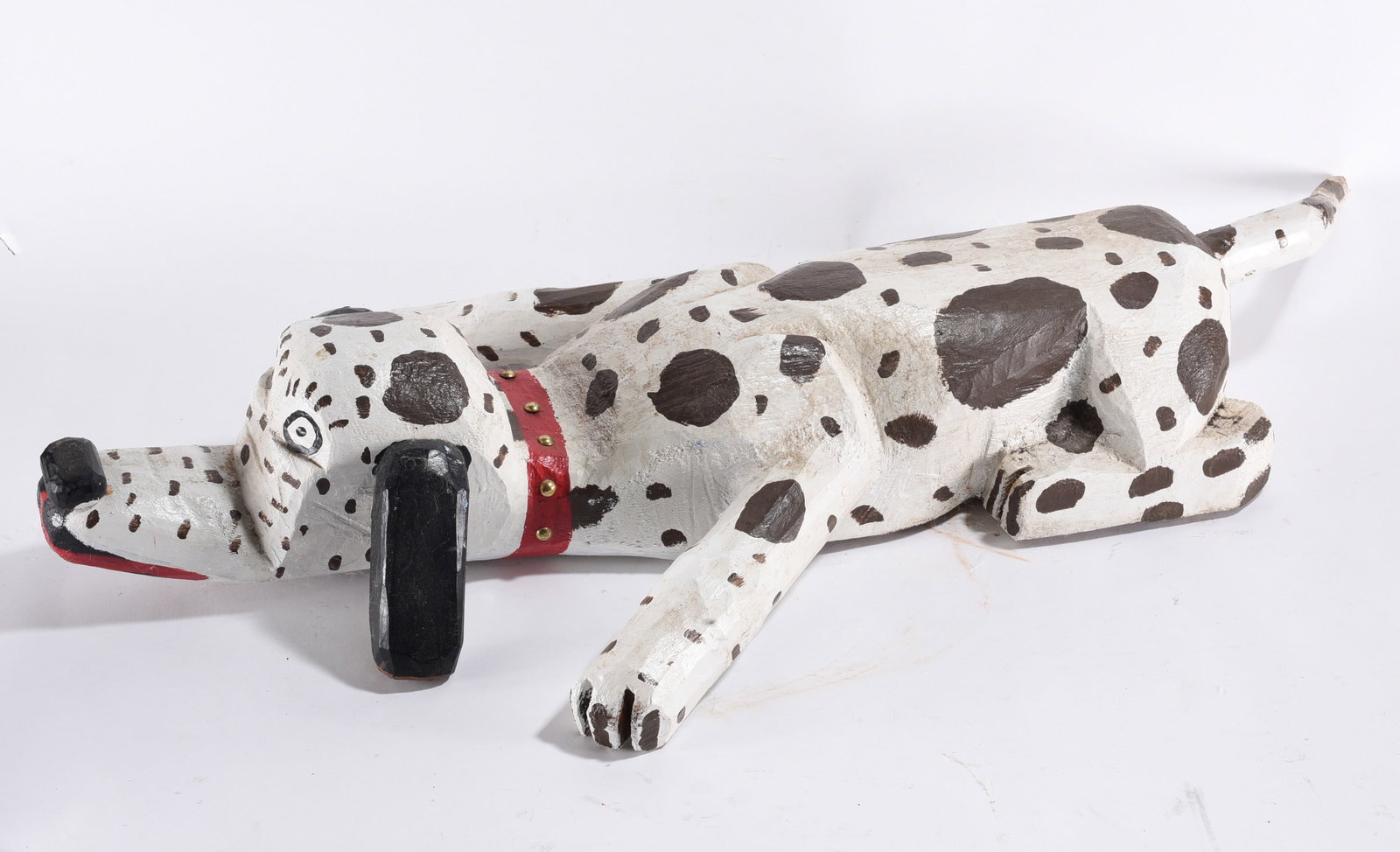 Jesse Hurst Carved Lying Dog: 6x40" --carved wood and paint, signed on bottom.. please see photos for condition. All items are in estate condition We do offer in house shipping for items under 36" boxes 10"x10"x10" we can ship for