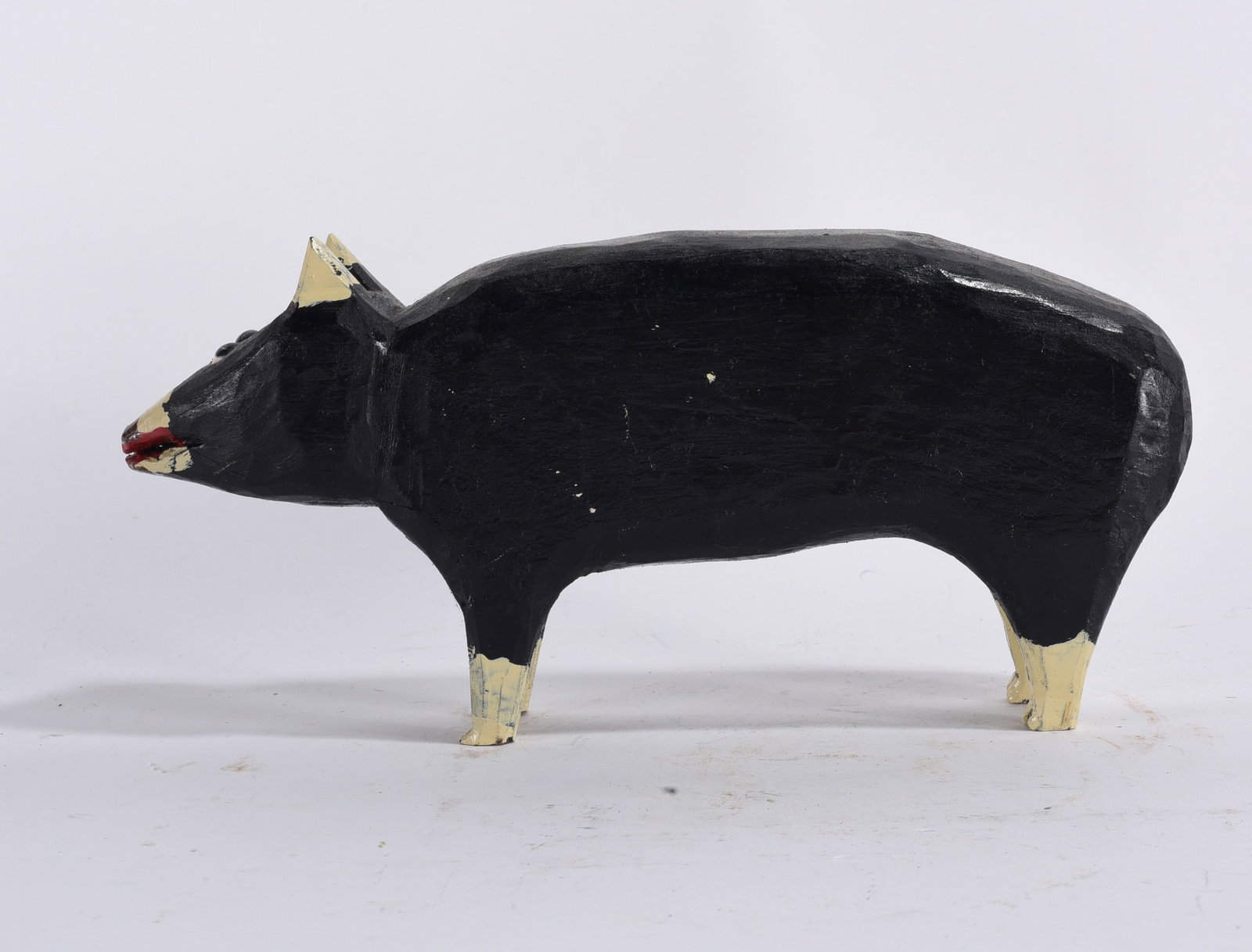 Denzil Goodpasture Carved Pig: 4"x10" -- carved wood and paint, signed DG on the feet. please see photos for condition. All items are in estate condition We do offer in house shipping for items under 36" boxes 10"x10"x10" we can sh