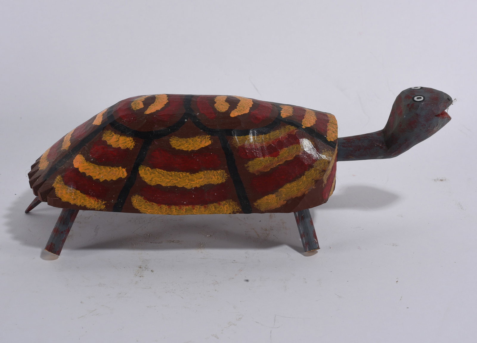 Harry Jennings Folk Art Turtle: 5"x13" -- carved wood and paint. Signed on bottom. please see photos for condition. All items are in estate condition We do offer in house shipping for items under 36" boxes 10"x10"x10" we can ship fo