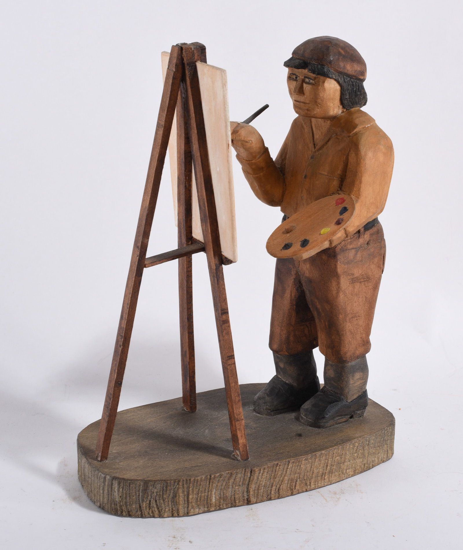 Folk Wood Carving of a Painter: 10"x7" -- nice wood carving of a painter at an easle. please see photos for condition. All items are in estate condition We do offer in house shipping for items under 36" boxes 10"x10"x10" we can ship