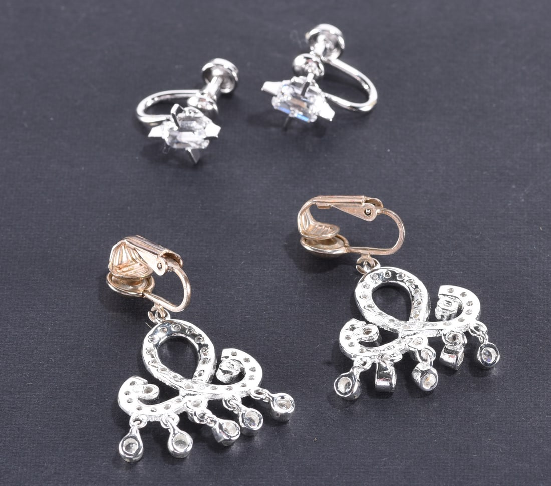 Sterling Silver and white crystal earrings. Marked 925. - 8.2 grams?plus; Sterling Silver Marred: Sterling Silver and white crystal earrings. Marked 925. - 8.2 grams?plus; Sterling Silver Marred screw back earrings with emerald cut crystal. - 2.9 grams.