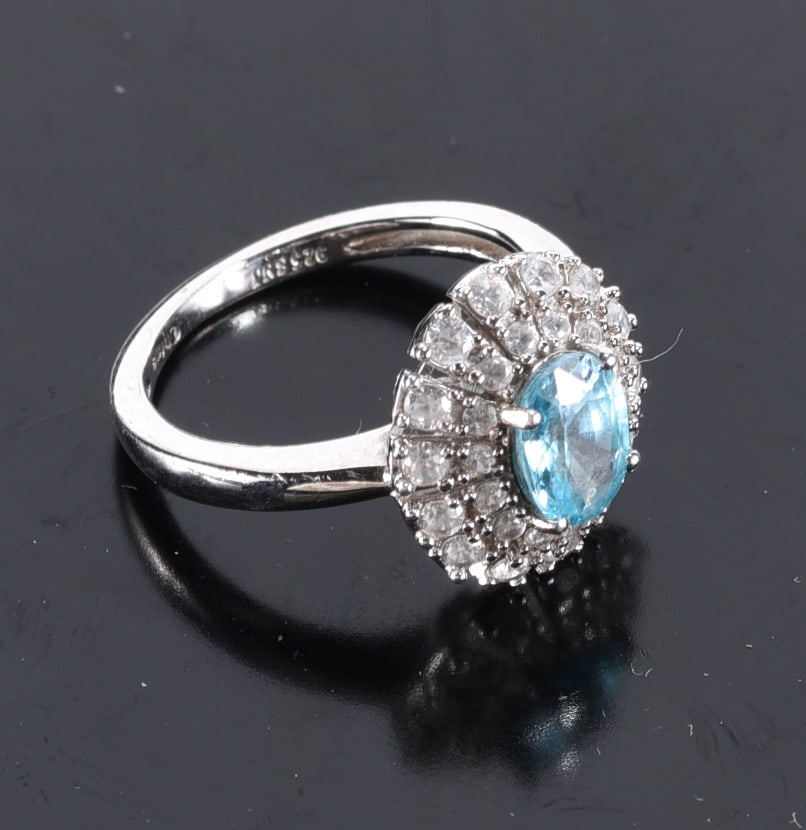 Sterling Silver SNJ Zircon colored stone oval N/S w/2 row star. Burst halo. White stones. Ring.: Sterling Silver SNJ Zircon colored stone oval N/S w/2 row star. Burst halo. White stones. Ring. Size 6-3/4